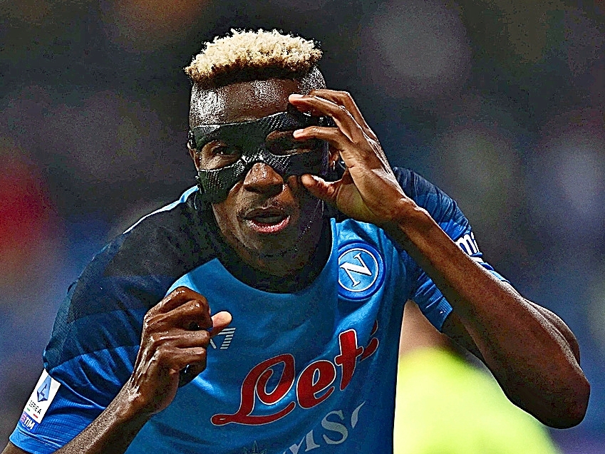 Napoli's Nigerian forward Victor Osimhen reacts after scoring his side's second goal during the Italian Serie A football match between Sassuolo and Napoli on February 17, 2023 at the Citta del tricolore stadium in Sassuolo. (Photo by Marco BERTORELLO / AFP)