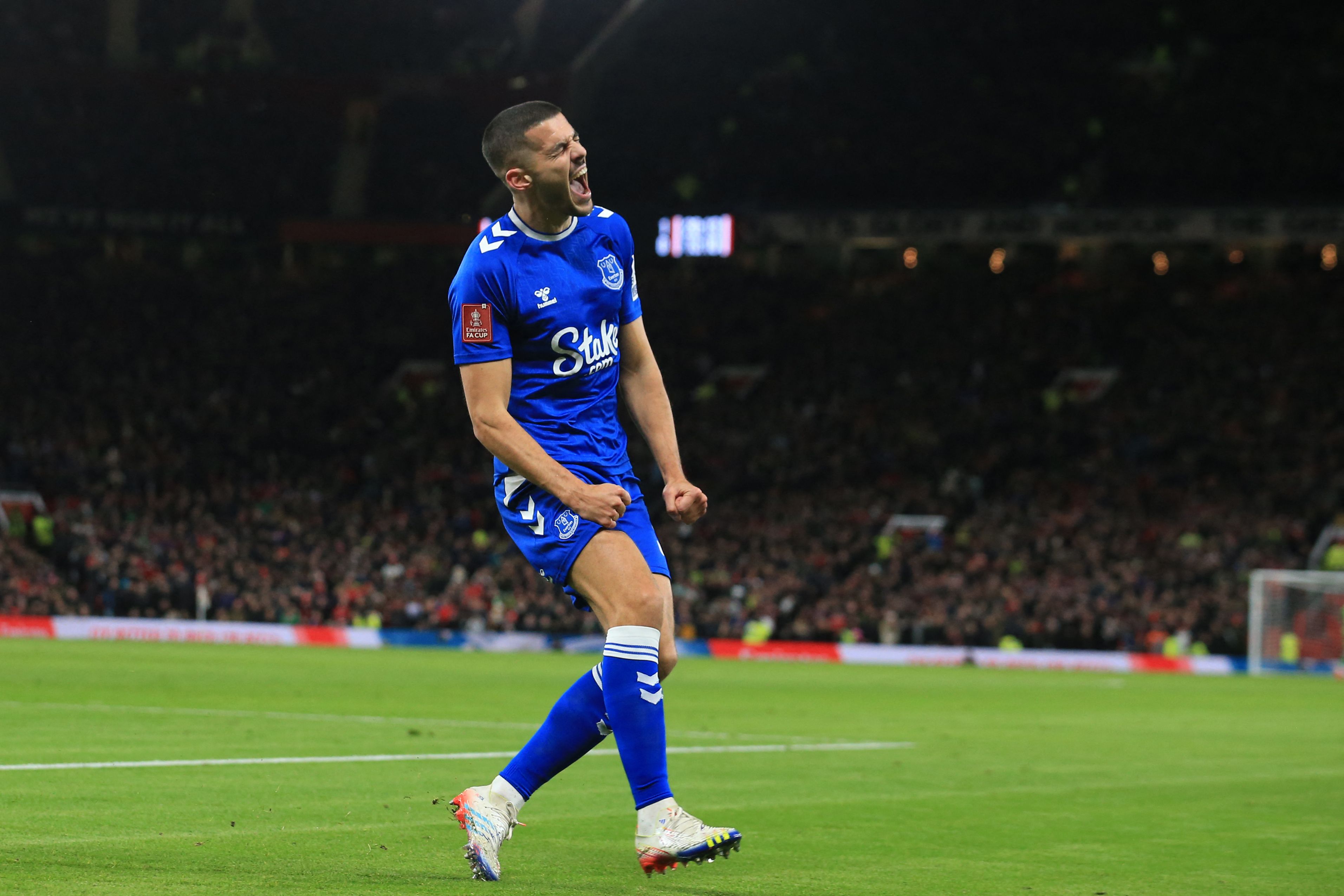 Everton's English defender Conor Coady celebrates after scoring their first goal during the English FA Cup third round football match between Manchester United and Everton at Old Trafford in Manchester, north west England, on January 6, 2023. (Photo by Lindsey Parnaby / AFP) / RESTRICTED TO EDITORIAL USE. No use with unauthorized audio, video, data, fixture lists, club/league logos or 'live' services. Online in-match use limited to 120 images. An additional 40 images may be used in extra time. No video emulation. Social media in-match use limited to 120 images. An additional 40 images may be used in extra time. No use in betting publications, games or single club/league/player publications. /