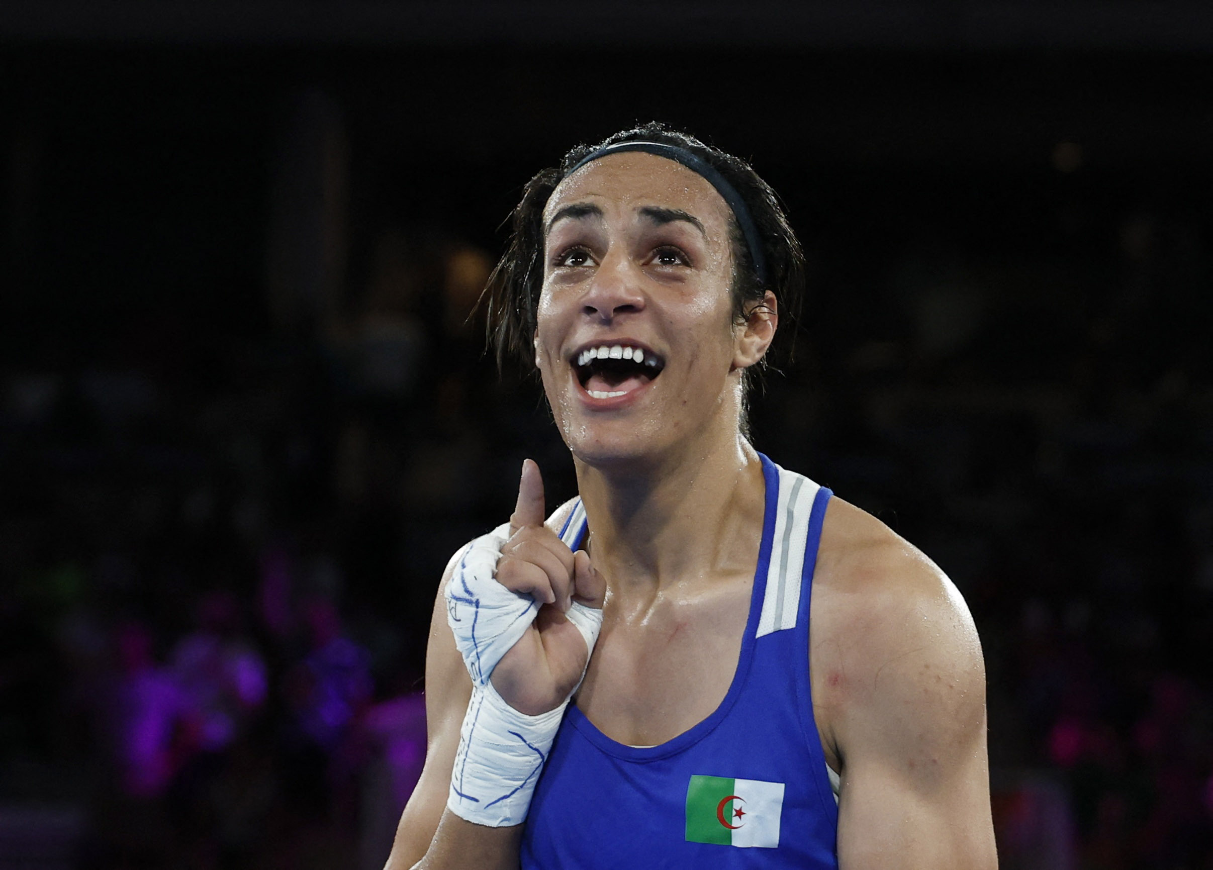 Paris 2024 Olympics - Boxing - Women's 66kg - Semifinal - Roland-Garros Stadium, Paris, France - August 06, 2024. Imane Khelif of Algeria reacts after winning her fight against Janjaem Suwannapheng of Thailand. REUTERS/Peter Cziborra