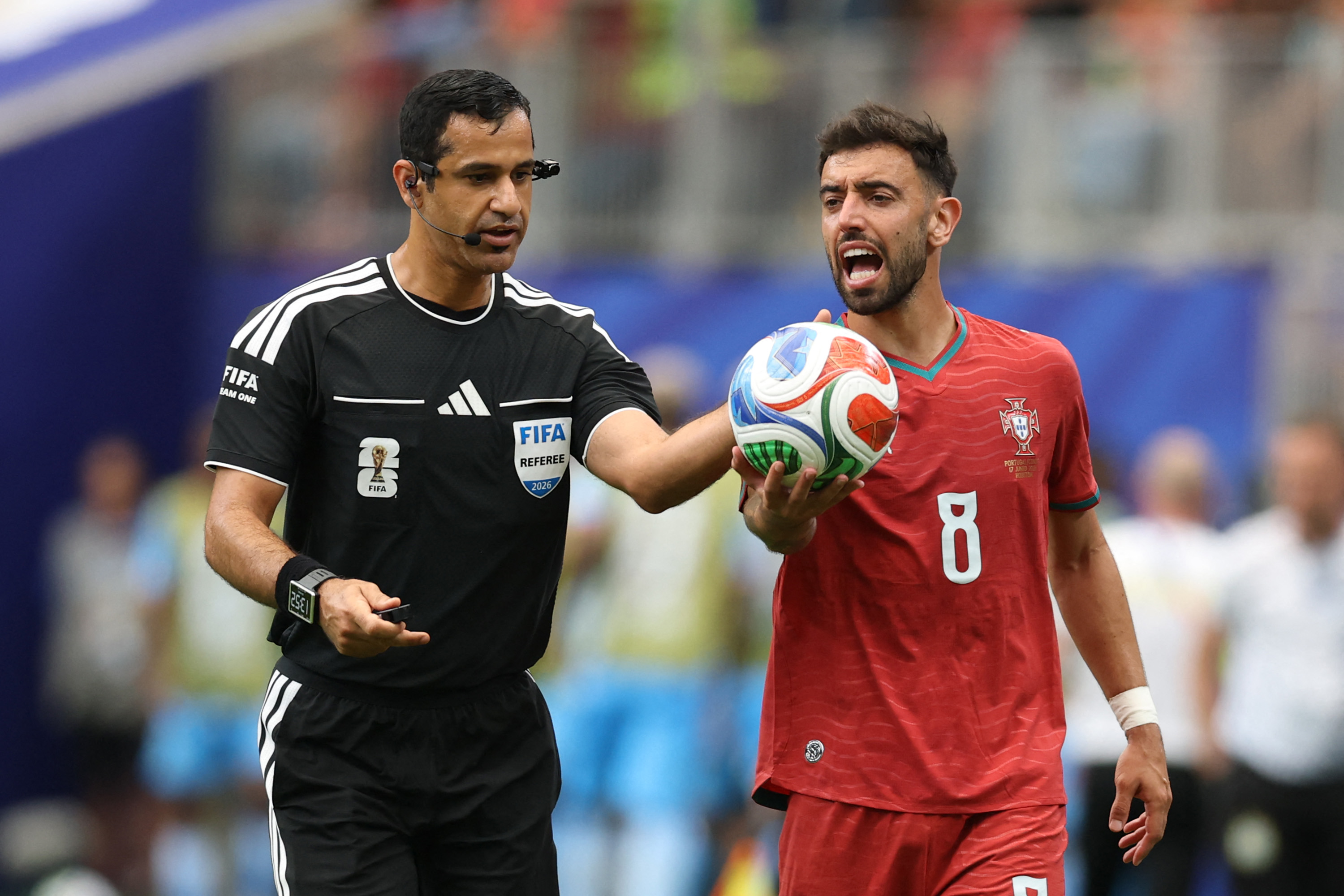 HOUSTON, TEXAS - JUNE 17: Bruno Fernandes #8 of Portugal argues with referee Abdulrahman Al Jassim during the FIFA World Cup 2026 Group K match between Portugal and Congo DR at Houston Stadium on June 17, 2026 in Houston, Texas. Molly Darlington/Getty Images/AFP (Photo by Molly Darlington / GETTY IMAGES NORTH AMERICA / Getty Images via AFP)