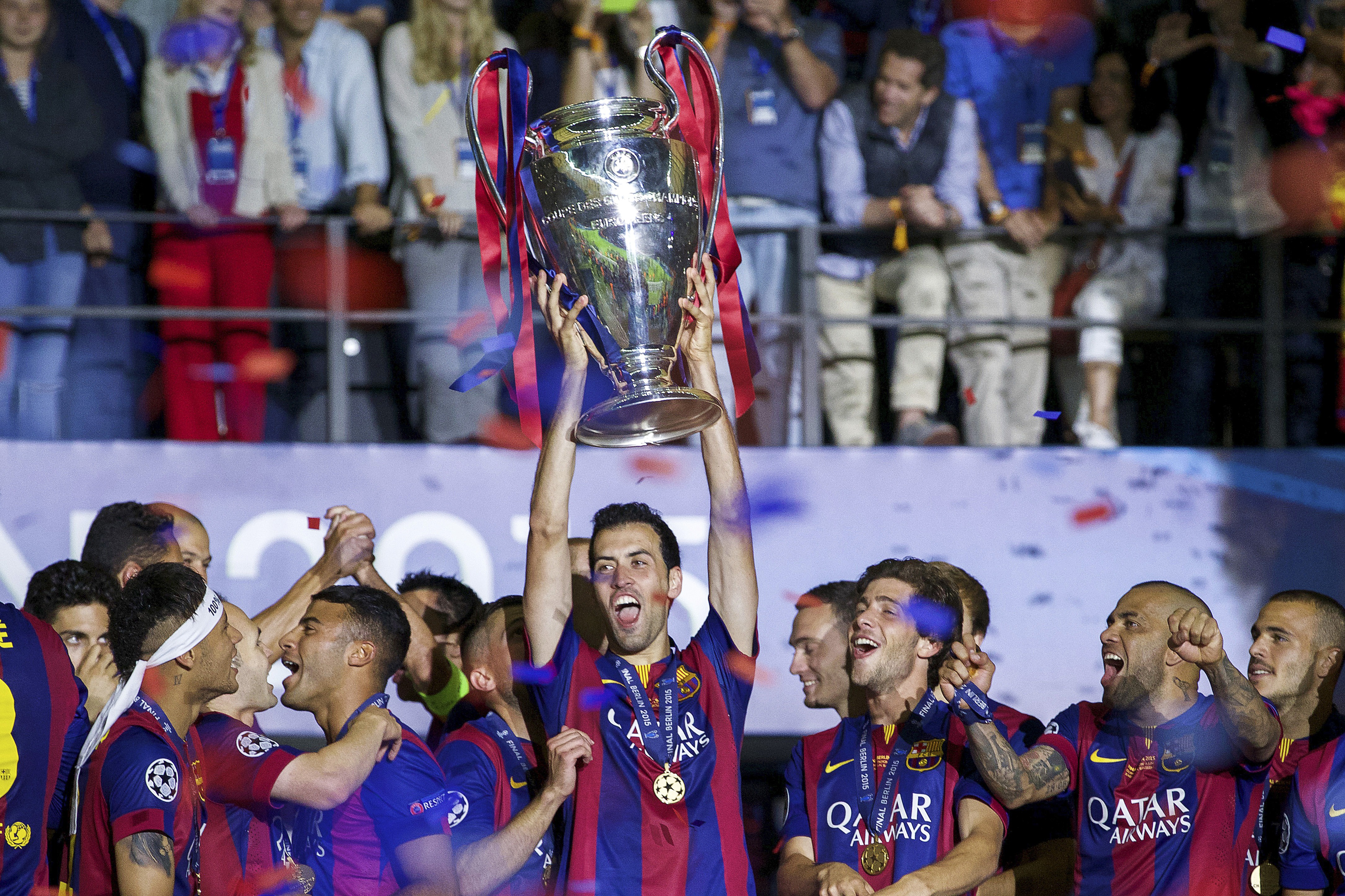 (L-R) Neymar of FC Barcelona, Andres Iniesta of FC Barcelona, Douglas of FC Barcelona, Sergio Busquets of FC Barcelona Thomas Vermaelen of FC Barcelona, Sergi Roberto of FC Barcelona, Dani Alves of FC Barcelona, Adriano of FC Barcelona with Champions League trophy during the UEFA Champions League  final match between Barcelona and Juventus on June 6, 2015 at the Olympic stadium in Berlin, Germany.(Photo by VI Images via Getty Images)