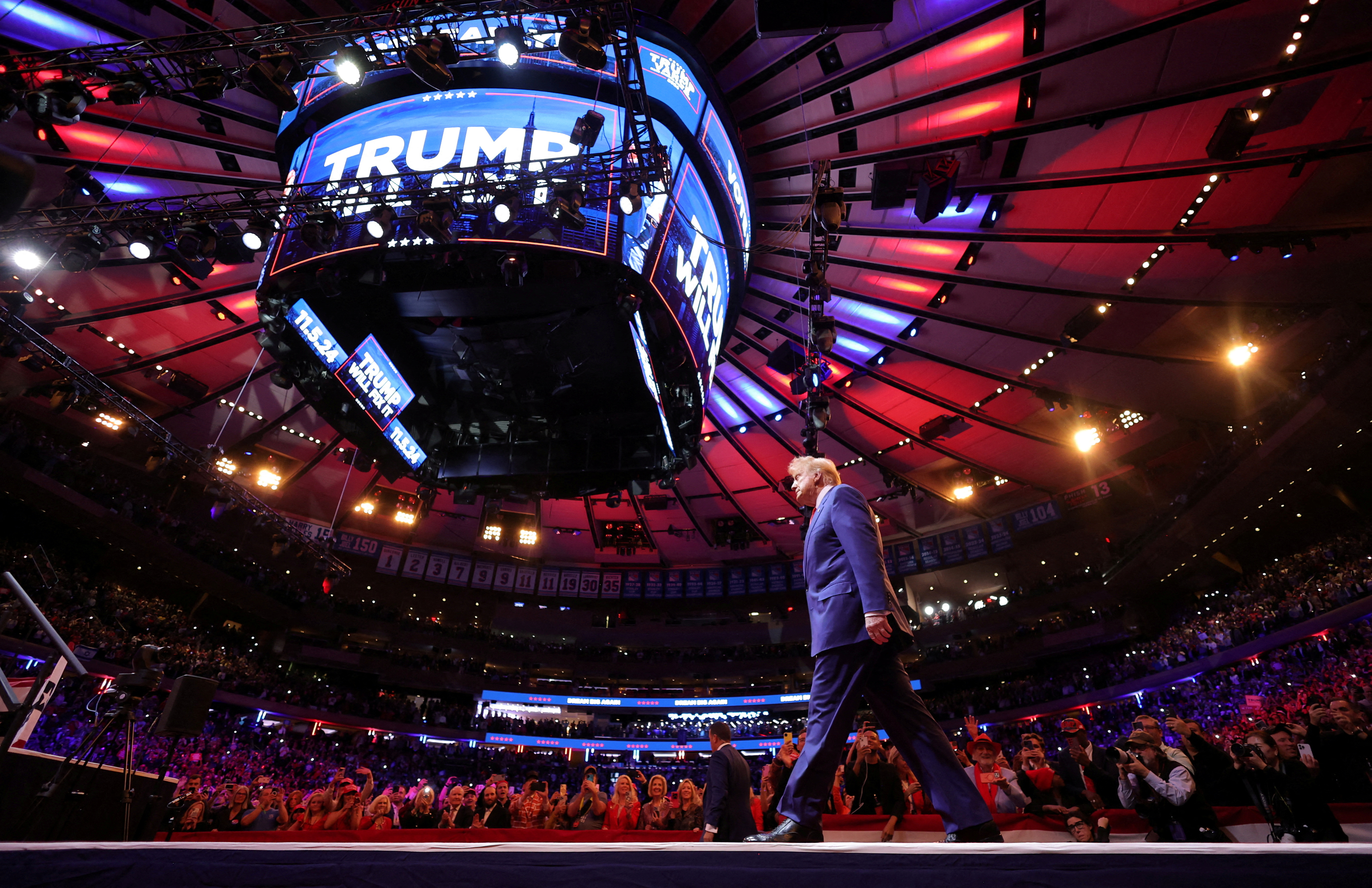 Republican presidential nominee and former U.S. President Donald Trump walks on stage during a rally at Madison Square Garden, in New York, U.S., October 27, 2024. REUTERS/Carlos Barria     TPX IMAGES OF THE DAY