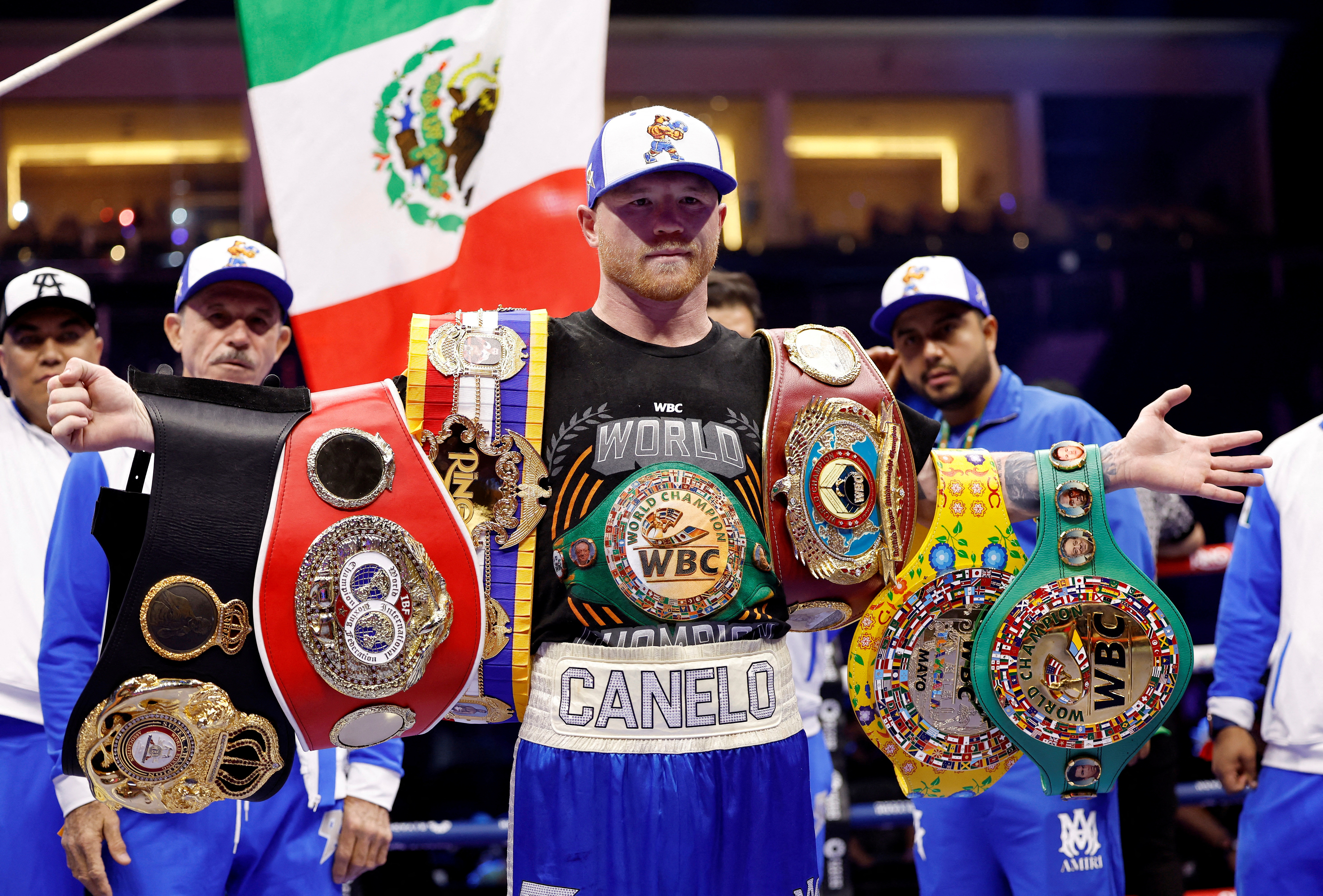 Boxing - Saul 'Canelo' Alvarez vs William Scull - Undisputed Super Middleweight Championship - ANB Arena, Riyadh, Saudi Arabia - May 3, 2025 Saul 'Canelo' Alvarez poses with his championship belts and celebrates after winning his super middleweight fight against William Scull REUTERS/Hamad I Mohammed     TPX IMAGES OF THE DAY
