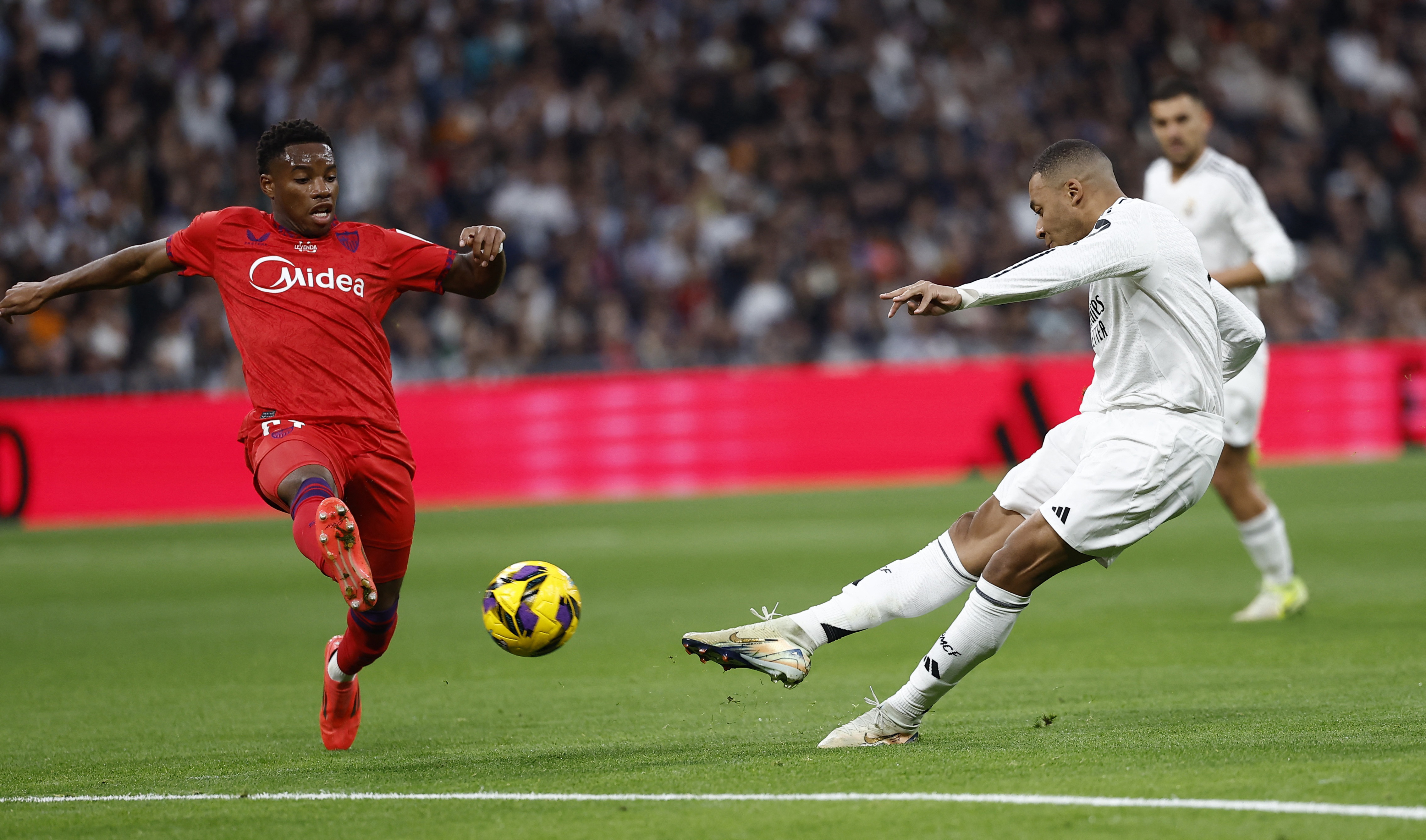 Soccer Football - LaLiga - Real Madrid v Sevilla - Santiago Bernabeu, Madrid, Spain - December 22, 2024 Real Madrid's Kylian Mbappe scores their first goal REUTERS/Juan Medina