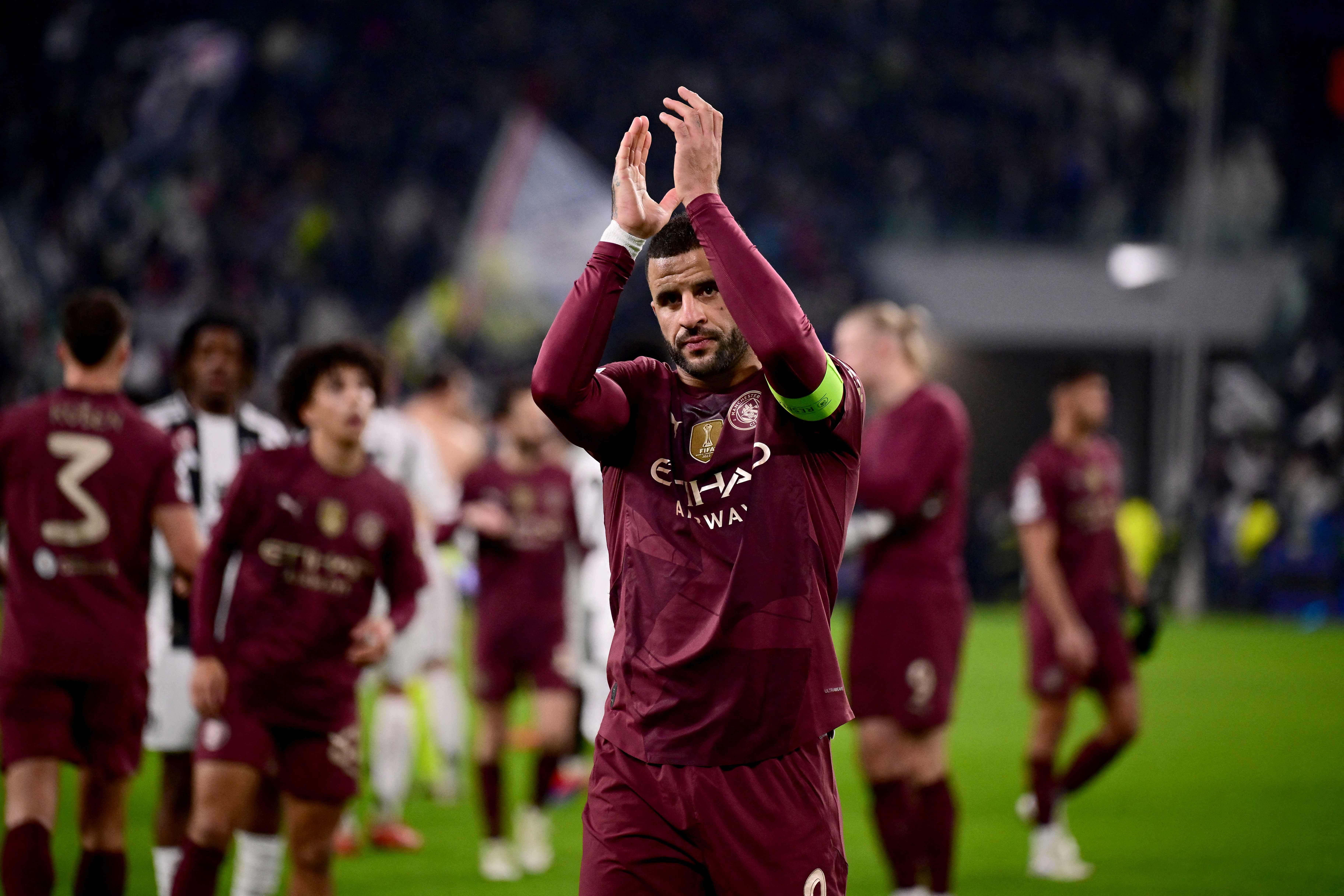 Manchester City's English defender #02 Kyle Walker (C) acknowledges the supporters at the end of the UEFA Champions League, league phase day 6, football match between Juventus (ITA) and Manchester City (ENG) at the Allianz stadium in Turin, on December 11, 2024. (Photo by Marco BERTORELLO / AFP)