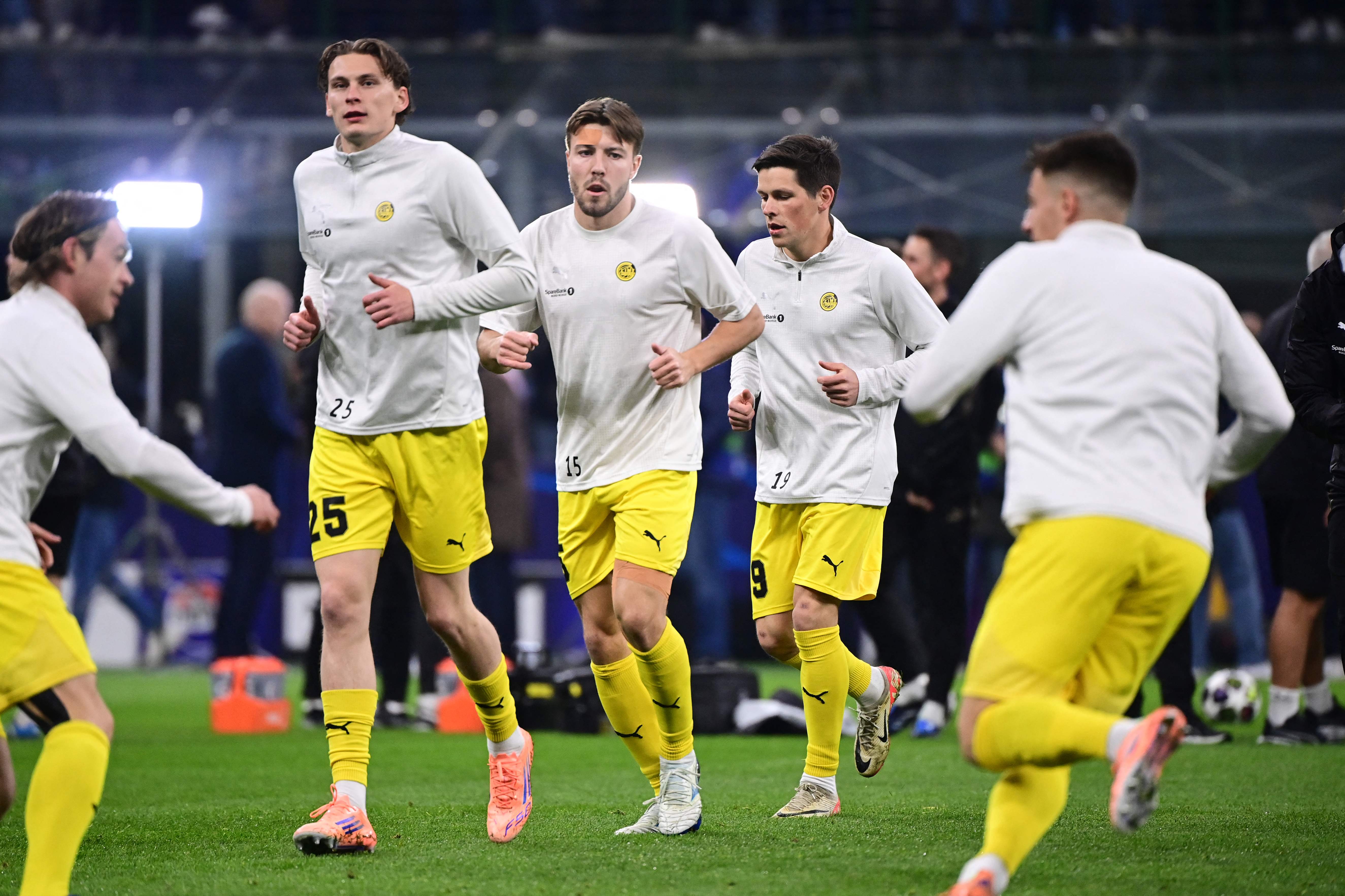 (From L) Bodo/Glimt's Norwegian defender #25 Isak Maatta, Bodo/Glimt's Norwegian defender #15 Fredrik Andre Bjorkan and Bodo/Glimt's Norwegian midfielder #19 Sondre Brunstad Fet warm-up before the UEFA Champions League second-leg play-off football match between Inter Milan and Bodo/Glimt at San Siro stadium in Milan, northern Italy, on February 24, 2026. (Photo by PIERO CRUCIATTI / AFP)