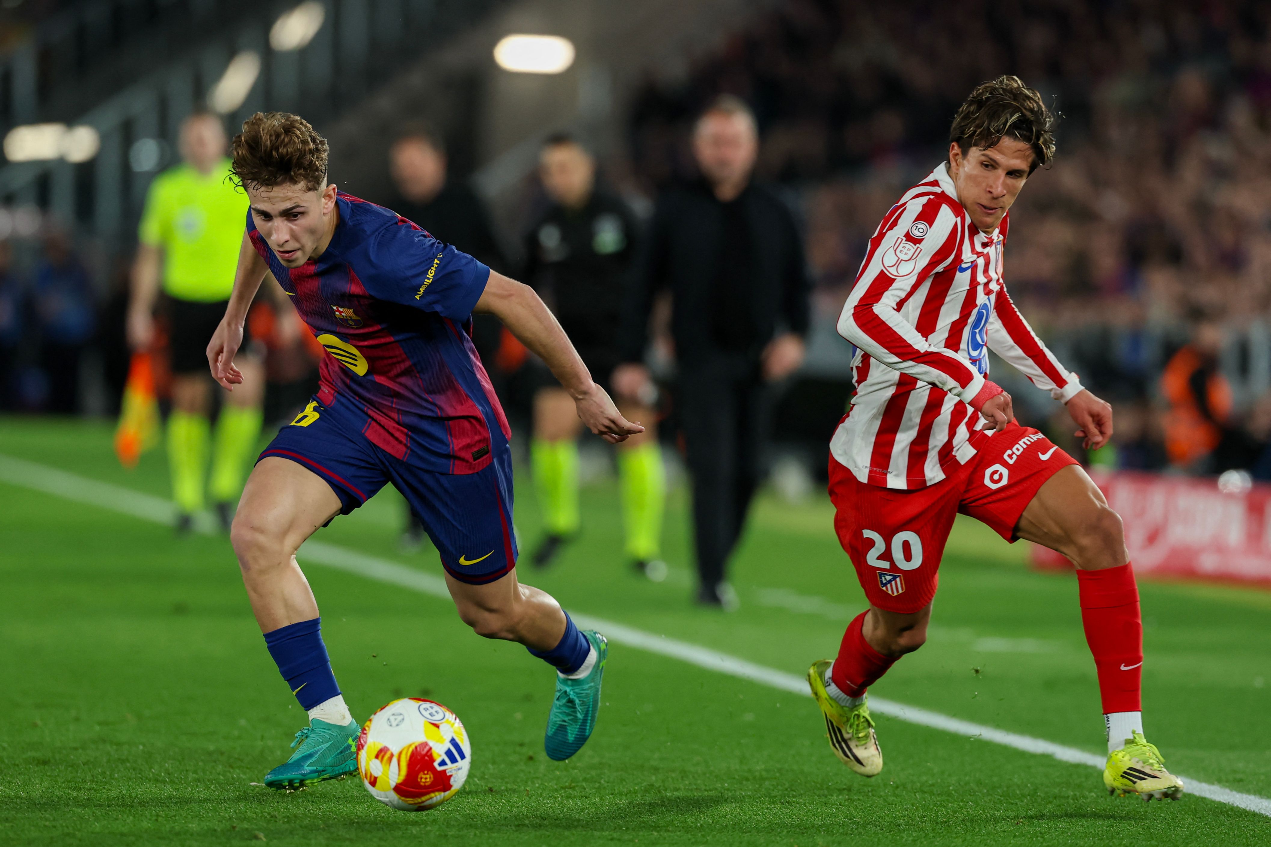 Barcelona's Spanish midfielder #16 Fermin Lopez (L) vies for the ball with Atletico Madrid's Argentine forward #20 Giuliano Simeone during the Copa del Rey (King's Cup) semi final second leg football match between FC Barcelona and Club Atletico de Madrid at Camp Nou Stadium in Barcelona on March 3, 2026. (Photo by Lluis GENE / AFP)