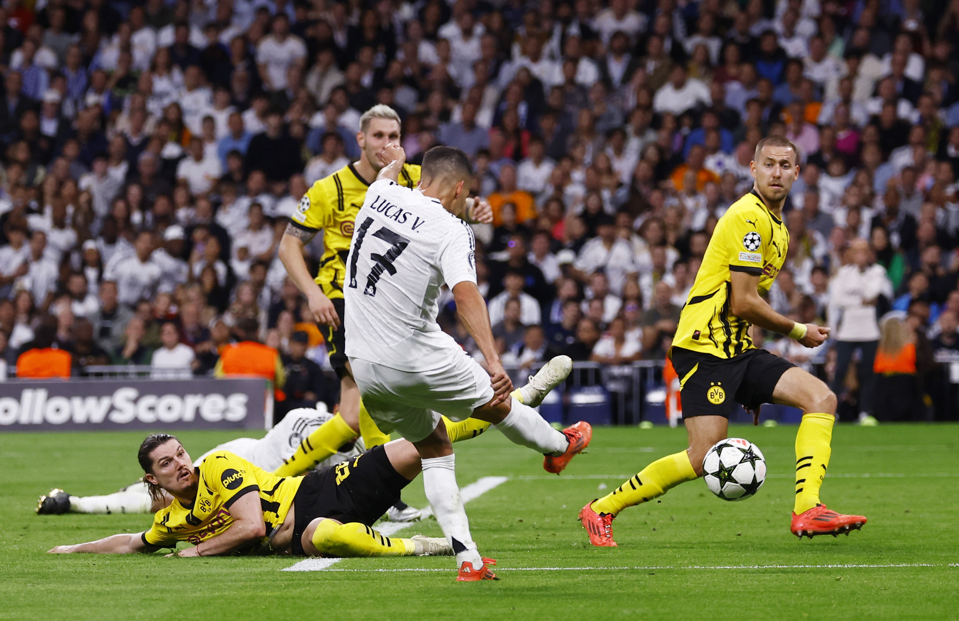 Soccer Football - Champions League - Real Madrid v Borussia Dortmund - Santiago Bernabeu, Madrid, Spain - October 22, 2024 Real Madrid's Lucas Vazquez scores their third goal REUTERS/Susana Vera