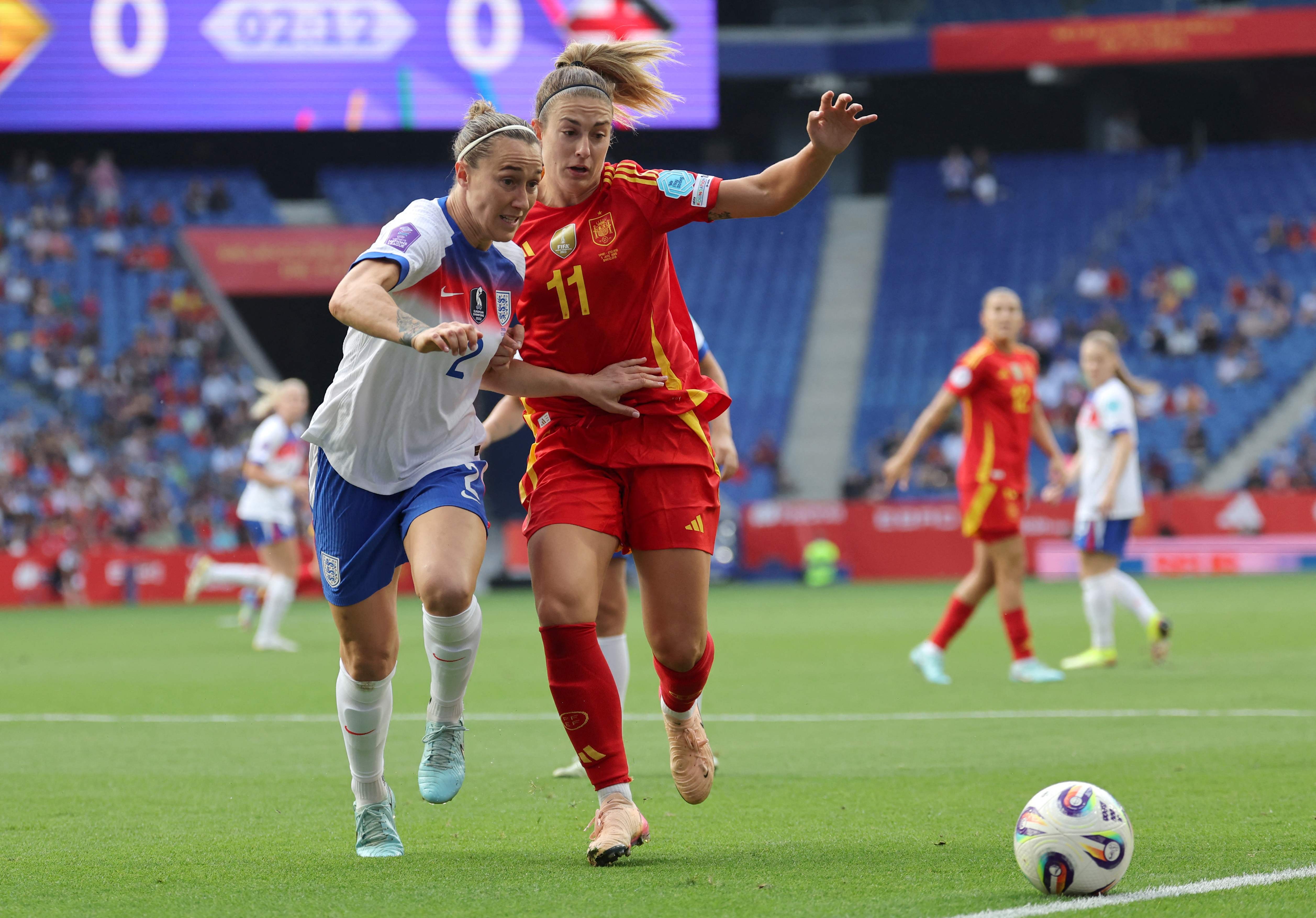 Spain's midfielder #11 Alexia Putellas fights for the ball with England's defender #02 Lucy Bronze during the UEFA Women's Nations League Group A3 football match between Spain and England at�the RCDE Stadium in Cornella de Llobregat, outside Barcelona, on June 3, 2025. (Photo by LLUIS GENE / AFP)