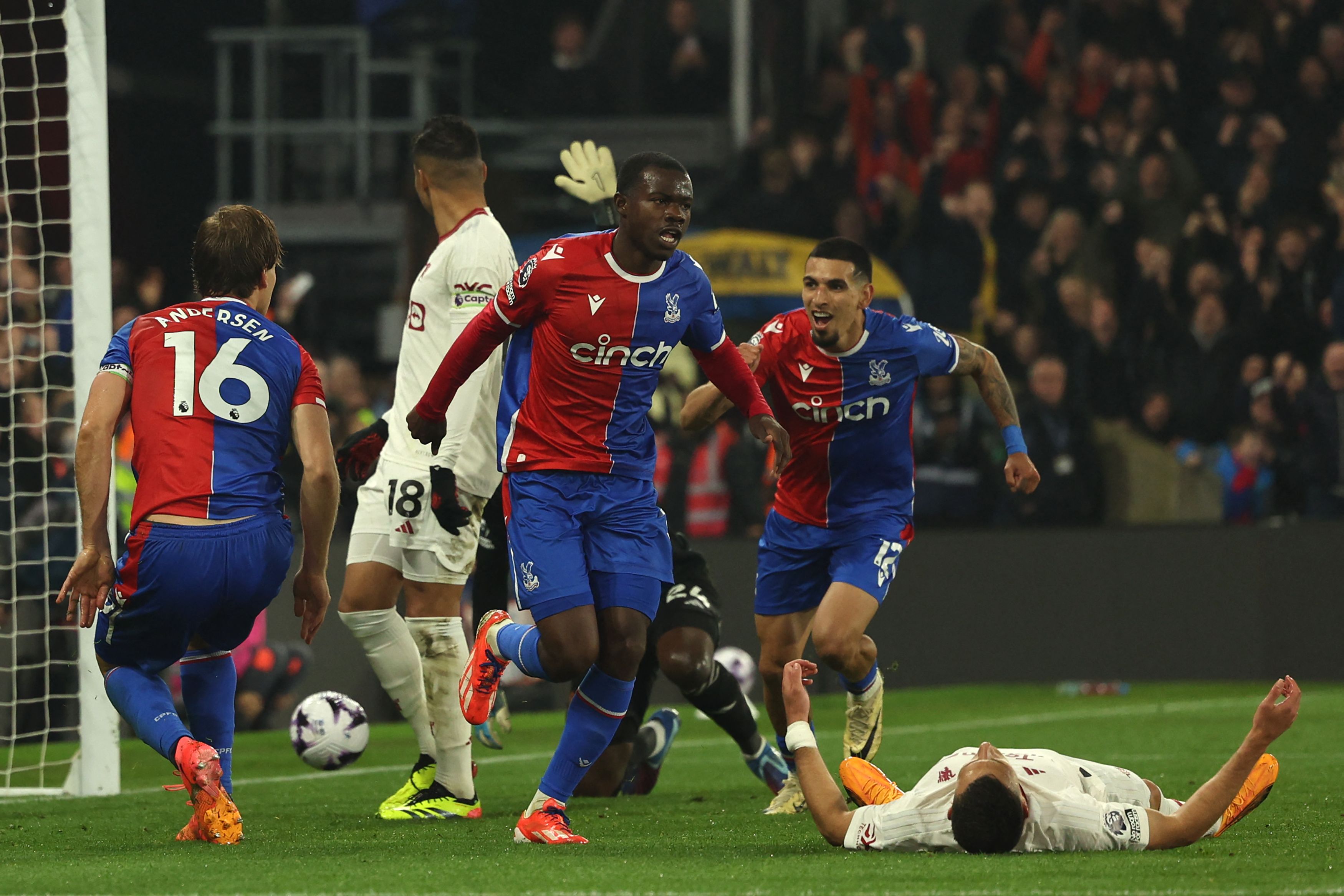 Crystal Palace's English defender #03 Tyrick Mitchell (C) celebrates after scoring their third goal during the English Premier League football match between Crystal Palace and Manchester United at Selhurst Park in south London on May 6, 2024. (Photo by Adrian DENNIS / AFP) / RESTRICTED TO EDITORIAL USE. No use with unauthorized audio, video, data, fixture lists, club/league logos or 'live' services. Online in-match use limited to 120 images. An additional 40 images may be used in extra time. No video emulation. Social media in-match use limited to 120 images. An additional 40 images may be used in extra time. No use in betting publications, games or single club/league/player publications. / 