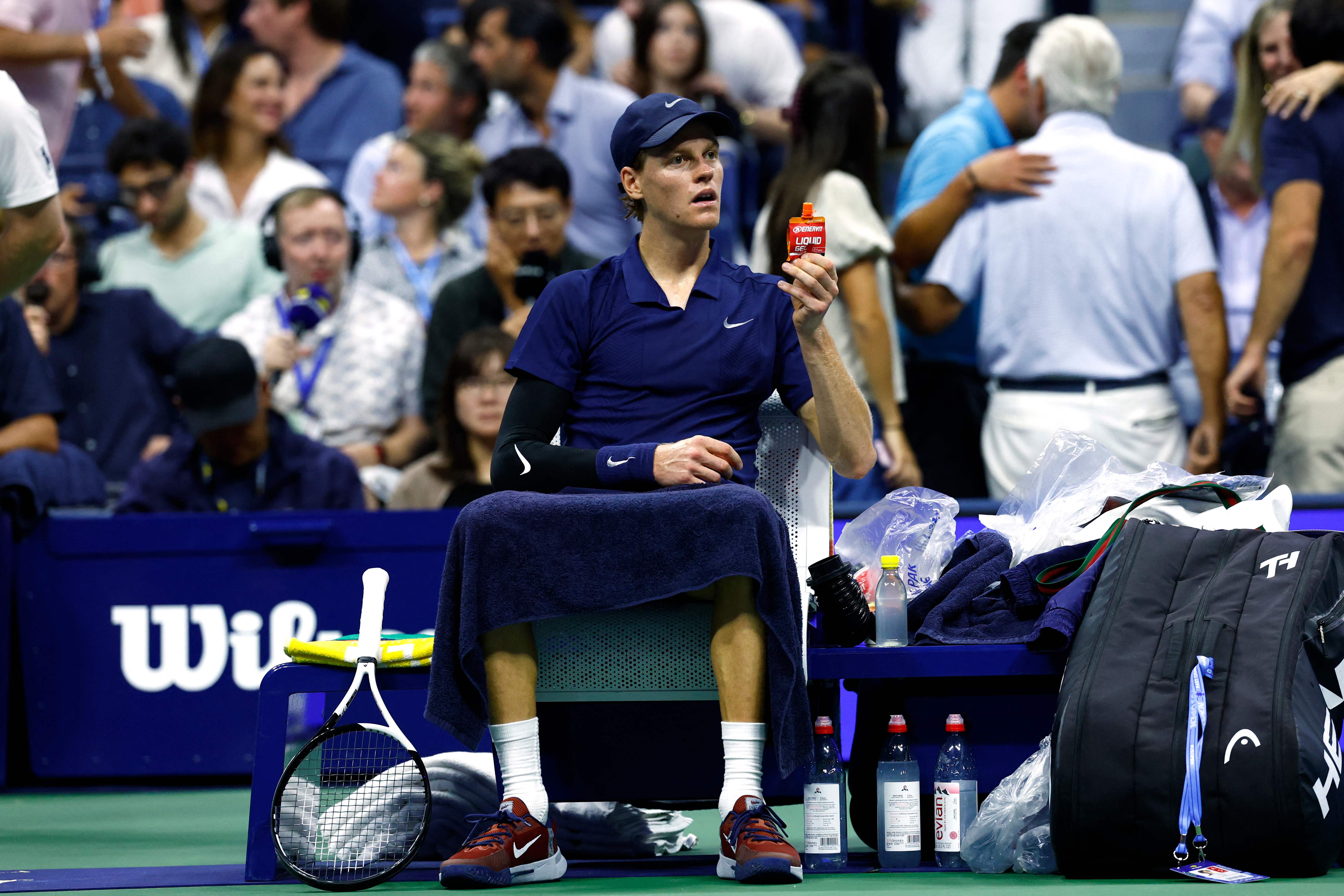 Italy�s Jannik Sinner sits during a break in his men's singles semifinal tennis match  against Canada�s Felix Auger-Aliassime on day thirteen of the US Open tennis tournament at the USTA Billie Jean King National Tennis Center in New York City, on September 5, 2025. (Photo by KENA BETANCUR / AFP)