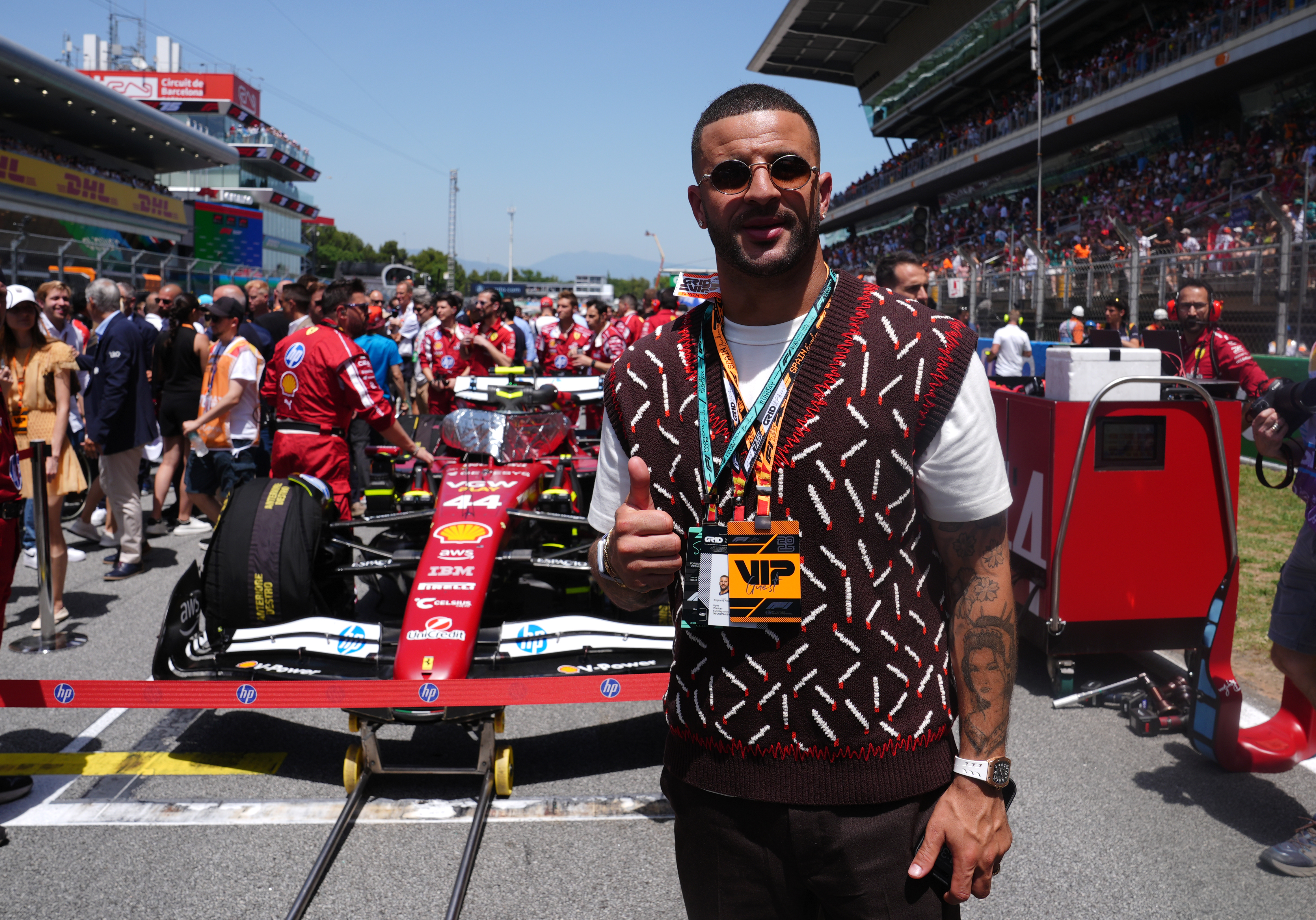England's Kyle Walker with the car of Ferrari's Lewis Hamilton on the grid before the race at the Circuit de Barcelona-Catalunya, Spain. Picture date: Sunday June 1, 2025. (Photo by Bradley Collyer/PA Images via Getty Images)