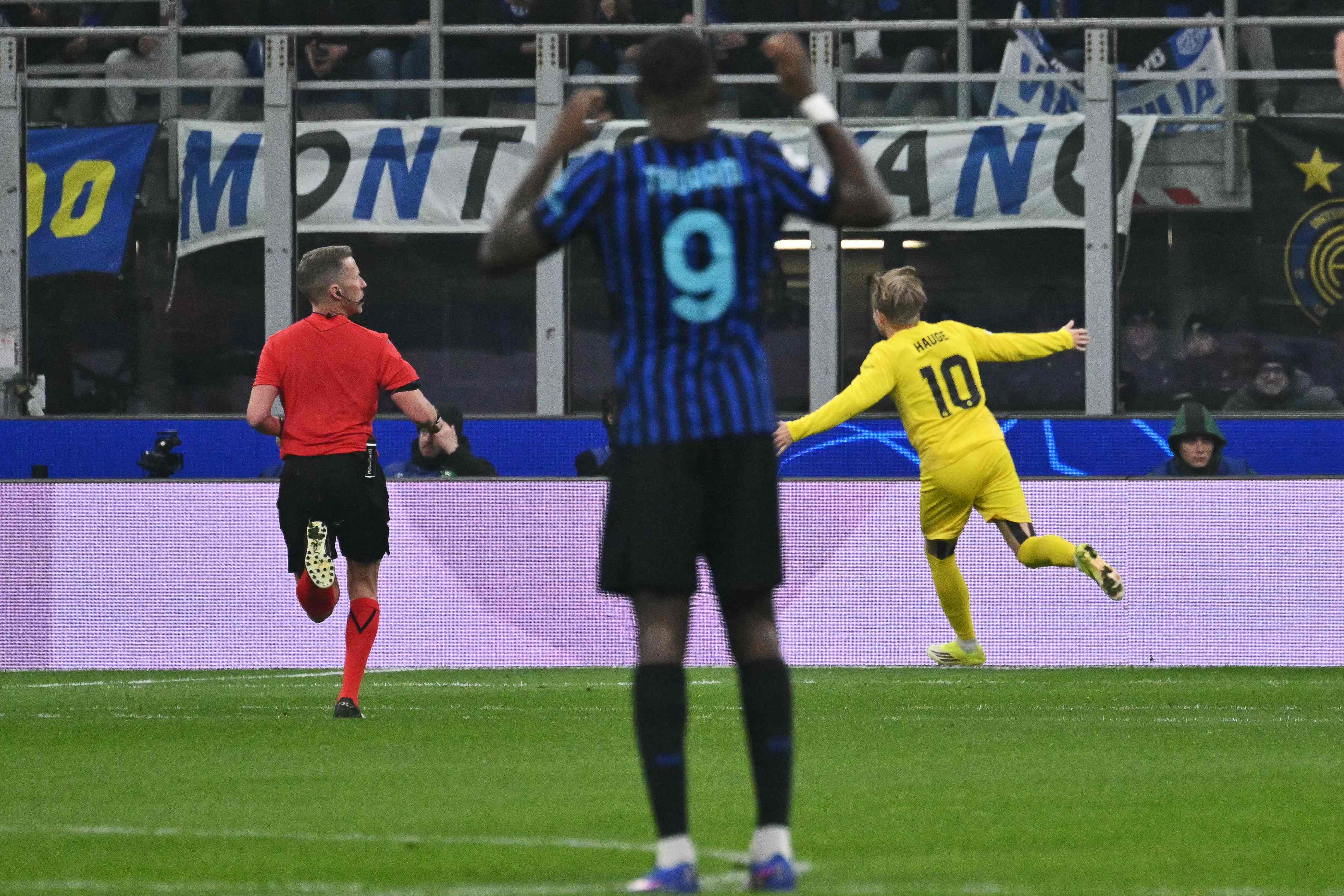 Bodo/Glimt's Norwegian forward #10 Jens Hauge (R) celebrates after scoring his team's first goal during the UEFA Champions League second-leg play-off football match between Inter Milan and Bodo/Glimt at San Siro stadium in Milan, northern Italy, on February 24, 2026. (Photo by Andreas SOLARO / AFP)