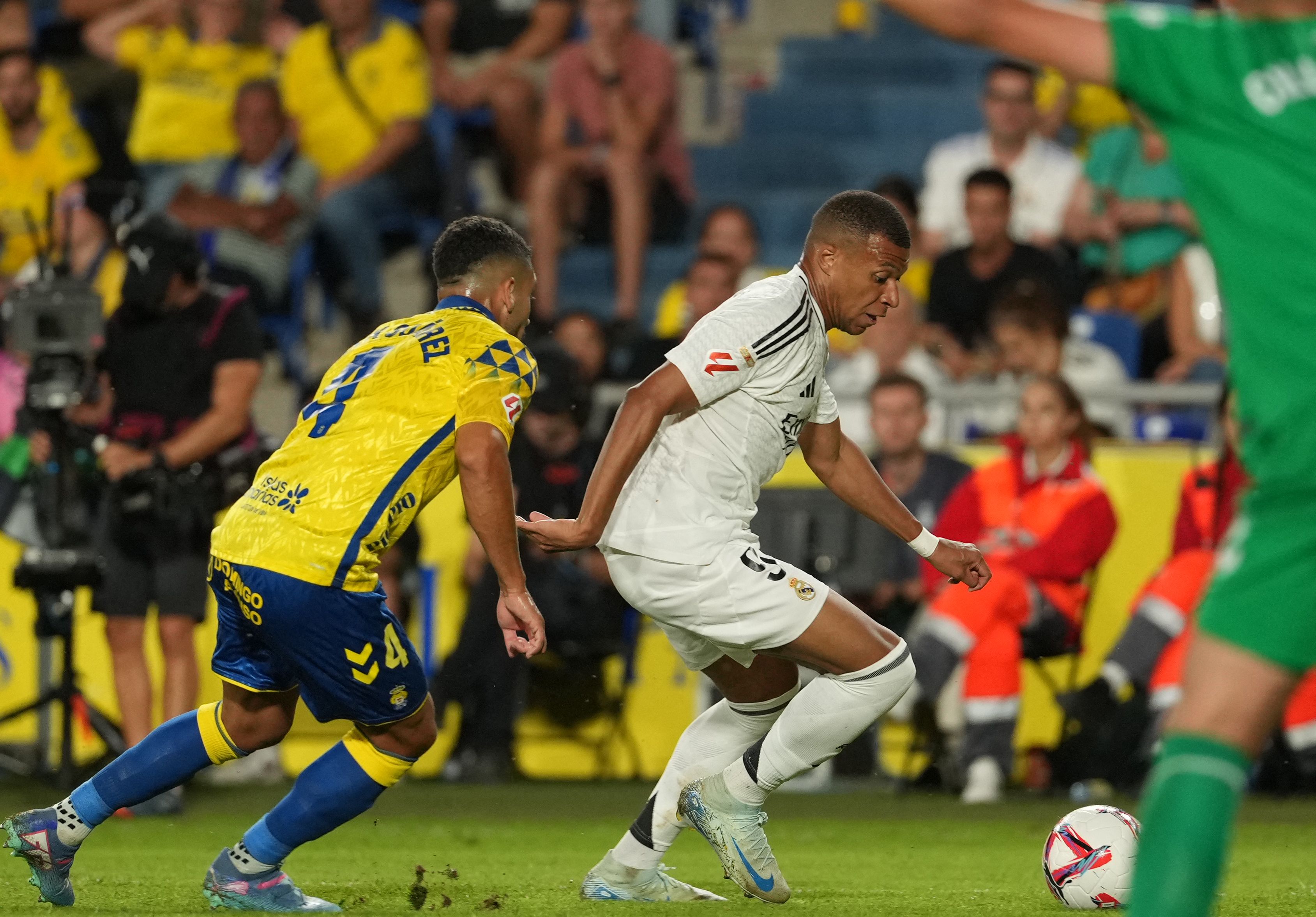 Real Madrid's French forward #09 Kylian Mbappe eyes the ball during the Spanish league football match between UD Las Palmas and Real Madrid CF at the Gran Canaria stadium in Las Palmas de Gran Canaria on August 29, 2024. (Photo by Cesar Manso / AFP)