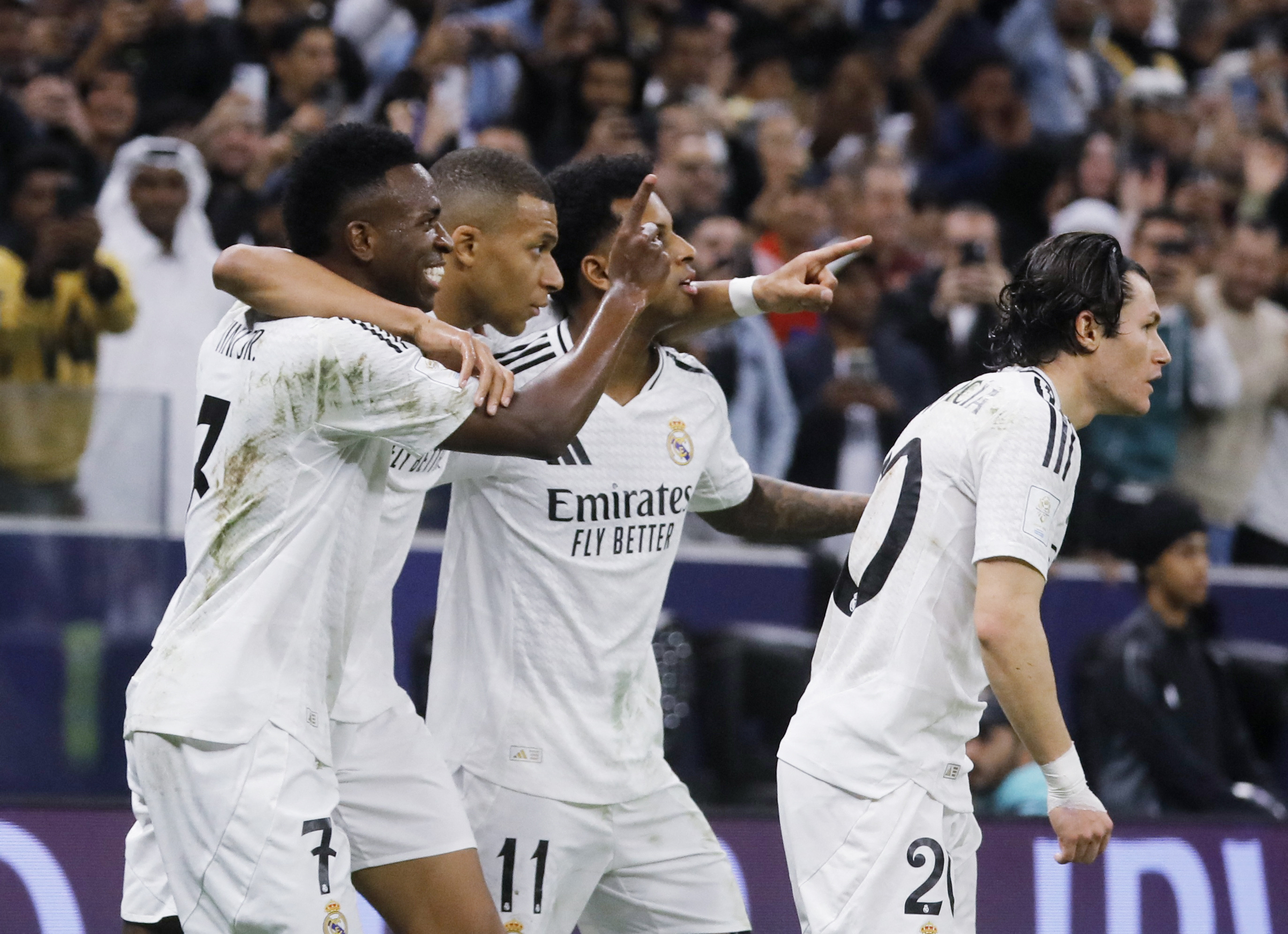 Soccer Football - Intercontinental Cup - Final - Real Madrid v Pachuca - Lusail Stadium, Lusail, Qatar - December 18, 2024 Real Madrid's Kylian Mbappe celebrates scoring their first goal with Vinicius Junior and Rodrygo and Fran Garcia REUTERS/Ibraheem Abu Mustafa