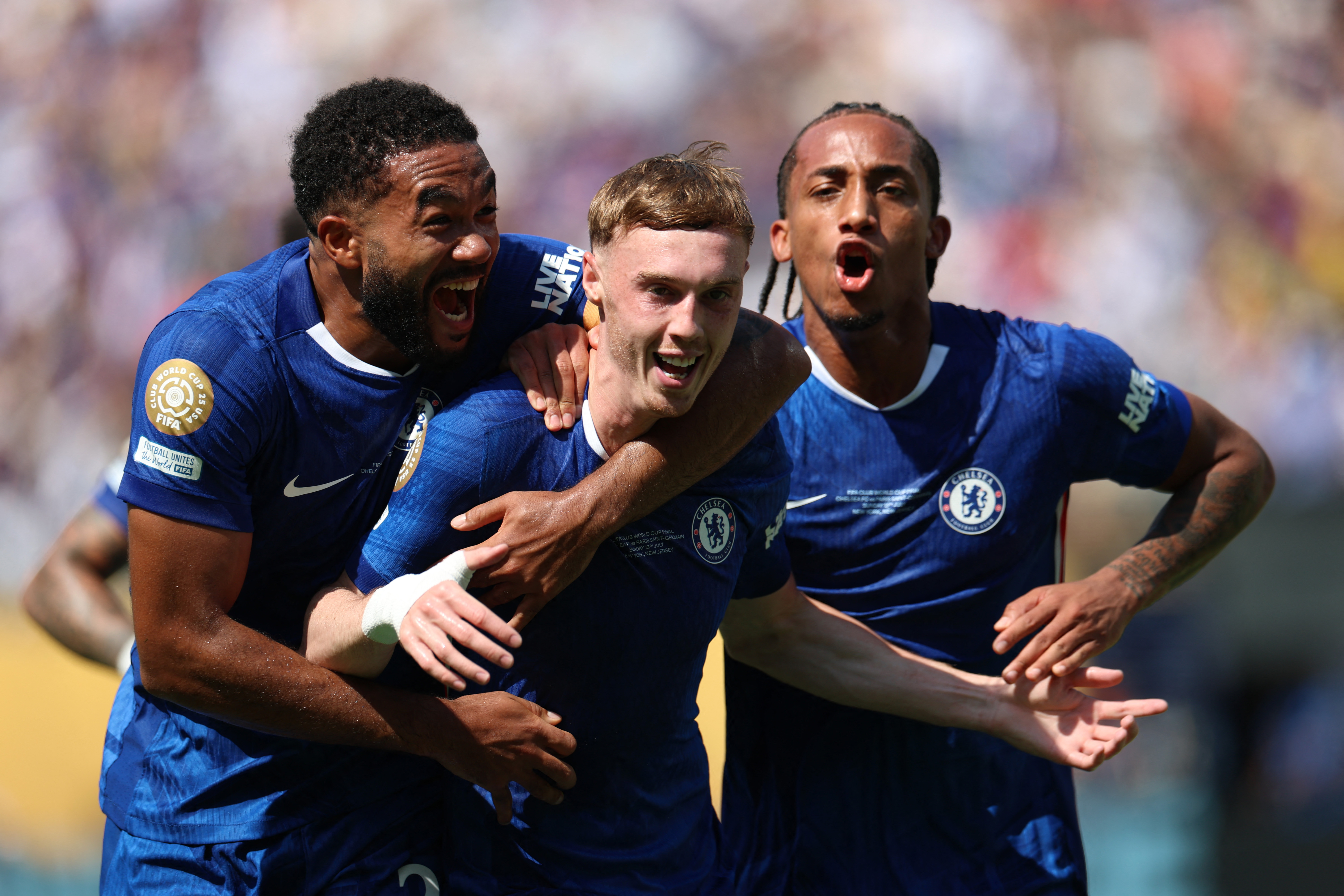 Soccer Football - FIFA Club World Cup - Final - Chelsea v Paris St Germain - MetLife Stadium, East Rutherford, New Jersey, U.S. - July 13, 2025 Chelsea's Cole Palmer celebrates scoring their second goal with Reece James and Joao Pedro REUTERS/Hannah Mckay