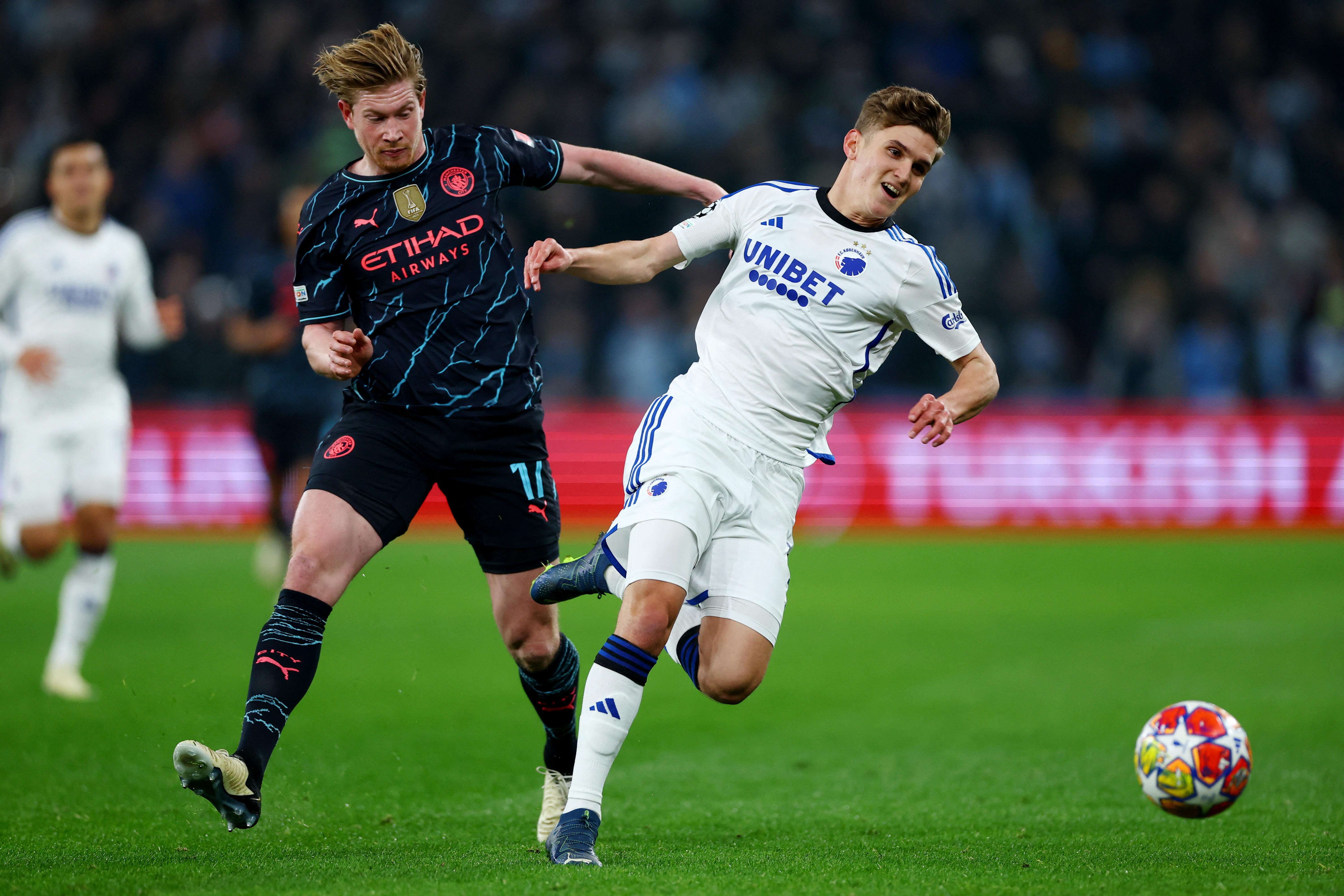 Soccer Football - Champions League - Round of 16 - First Leg - FC Copenhagen v Manchester City - Parken, Copenhagen, Denmark - February 13, 2024 Manchester City's Kevin De Bruyne in action with FC Copenhagen's Elias Jelert Kristensen Action Images via Reuters/Matthew Childs