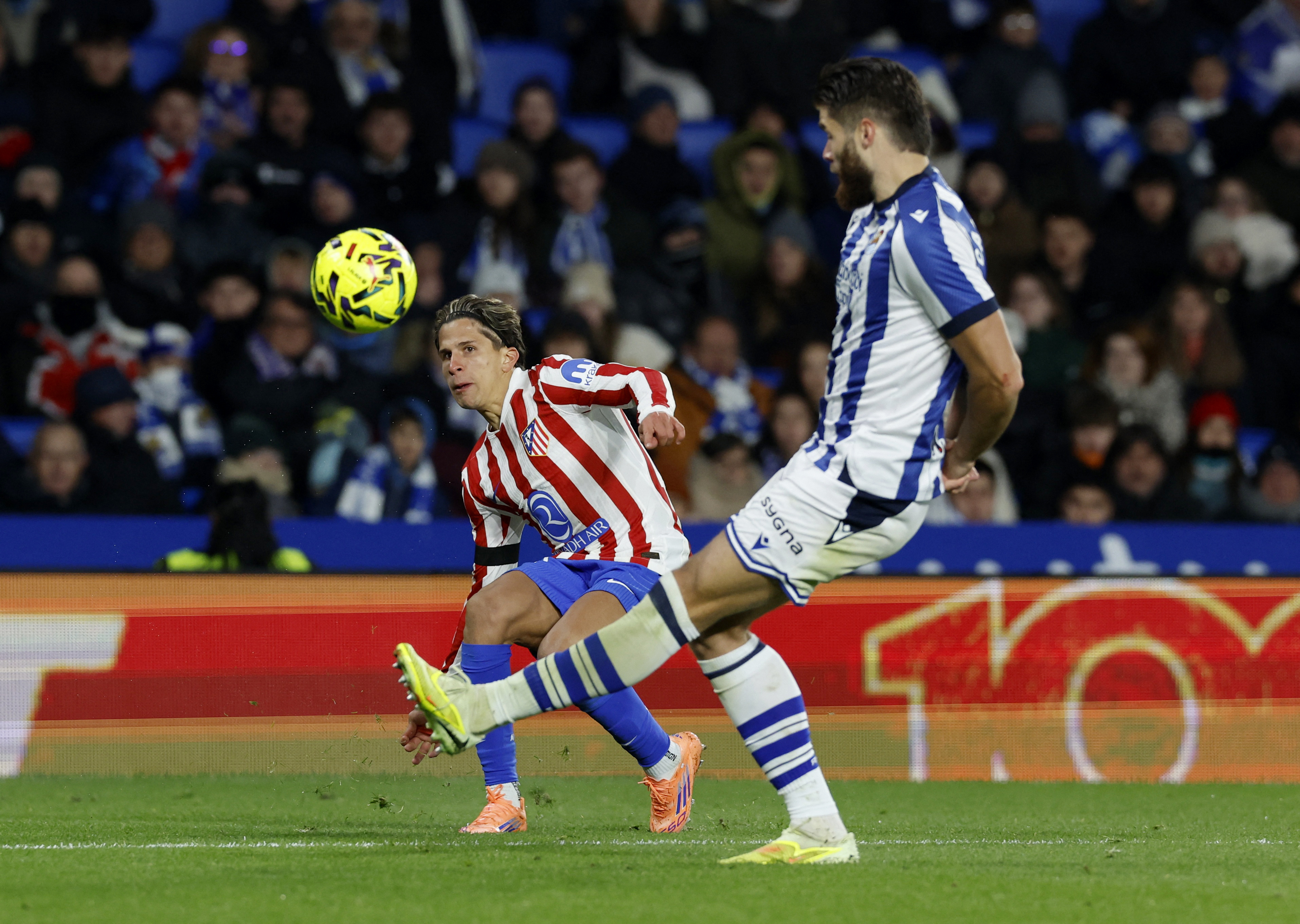 Soccer Football - LaLiga - Real Sociedad v Atletico Madrid - Reale Arena, San Sebastian, Spain - January 4, 2026 Atletico Madrid's Giuliano Simeone in action with Real Sociedad Duje Caleta-Car REUTERS/Vincent West