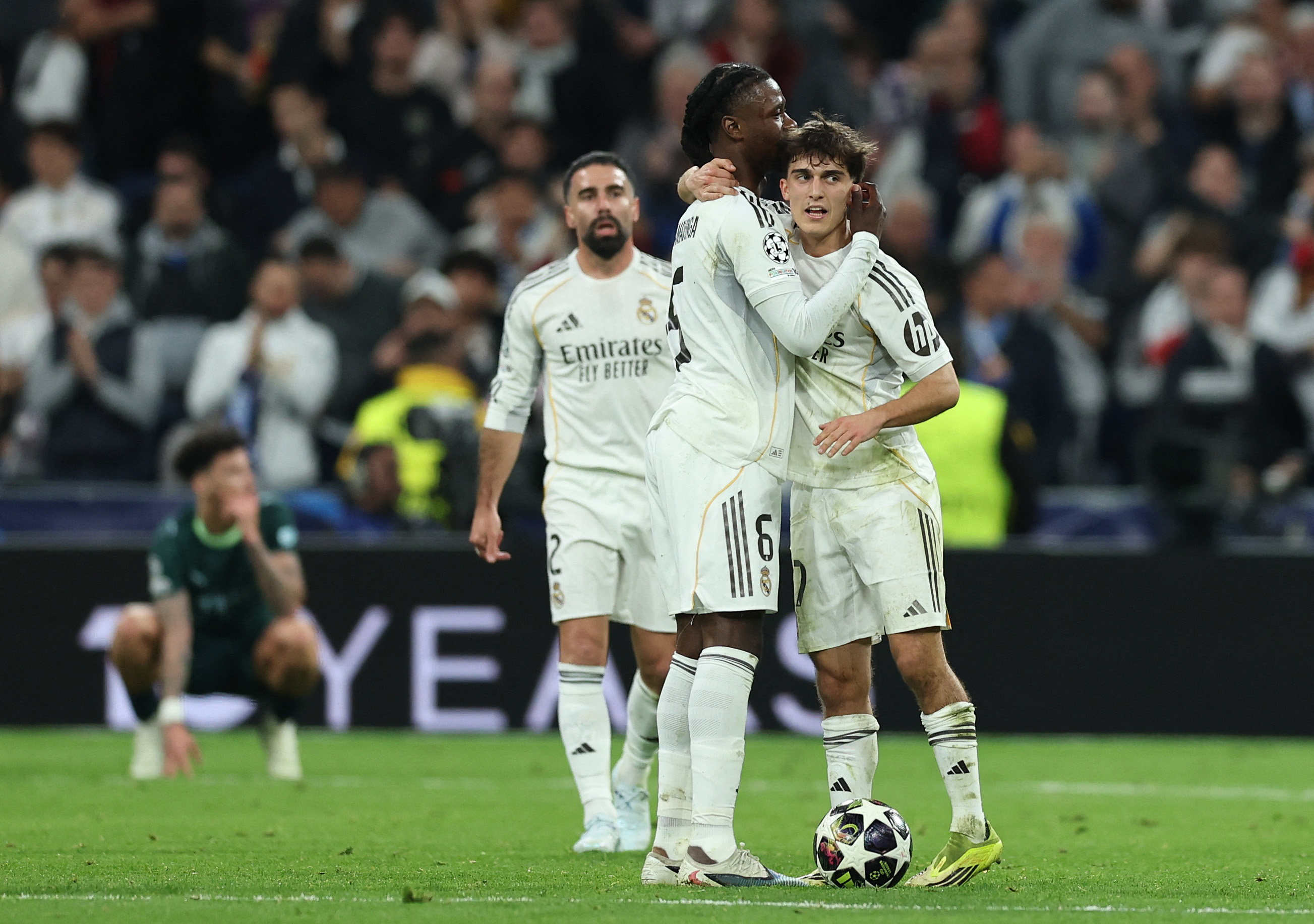 Soccer Football - UEFA Champions League - Round of 16 - First Leg - Real Madrid v Manchester City - Santiago Bernabeu, Madrid, Spain - March 11, 2026 Real Madrid's Manuel Angel Moran and Eduardo Camavinga celebrate after the match REUTERS/Violeta Santos Moura