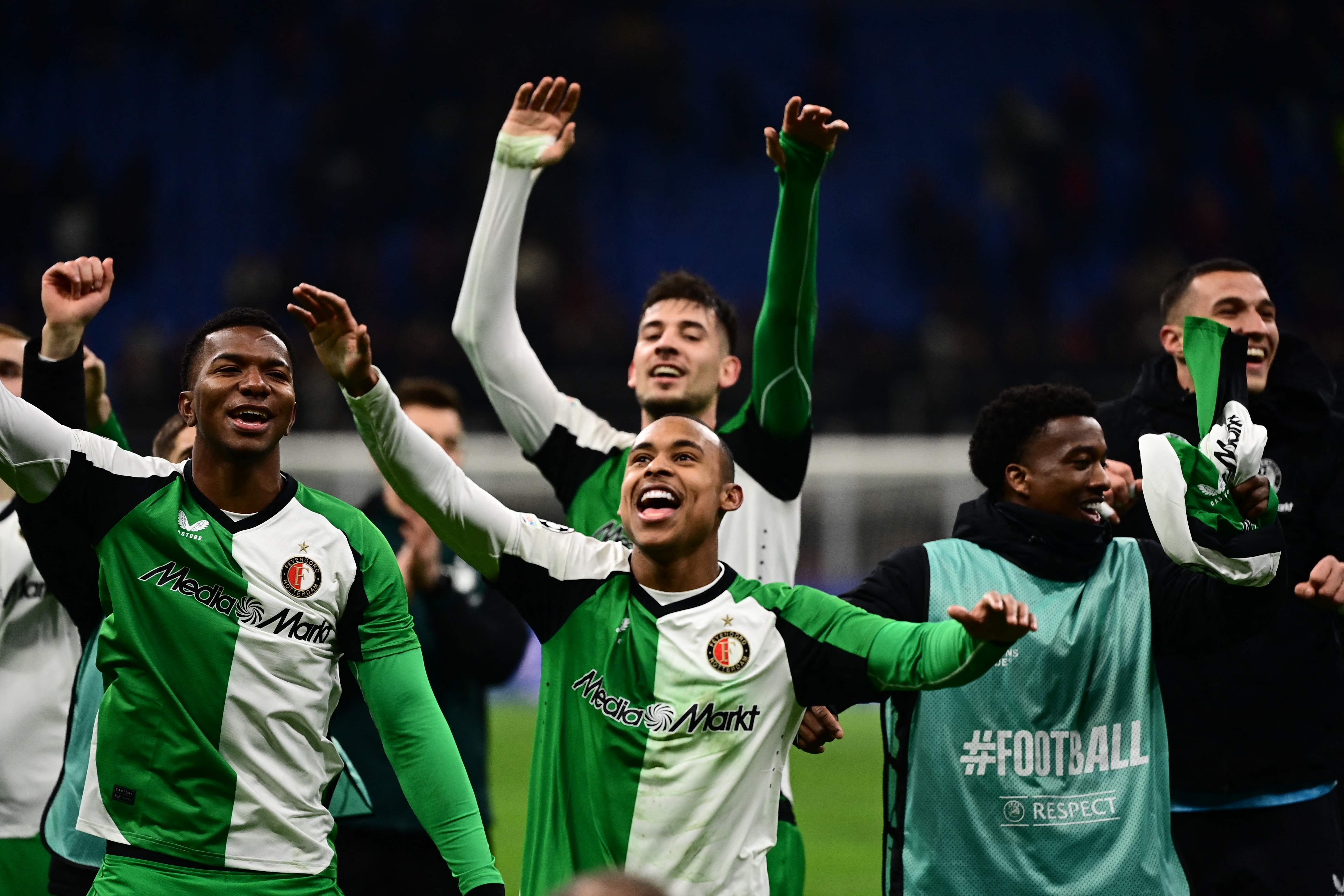 Feyenoord's Brazilian forward #14 Igor Paixao (C) celebrates with teammates at the end of during the UEFA Champions League knockout round play-off second leg football match between AC Milan and Feyenoord at San Siro stadium in Milan, on February 18, 2025. (Photo by Piero CRUCIATTI / AFP)