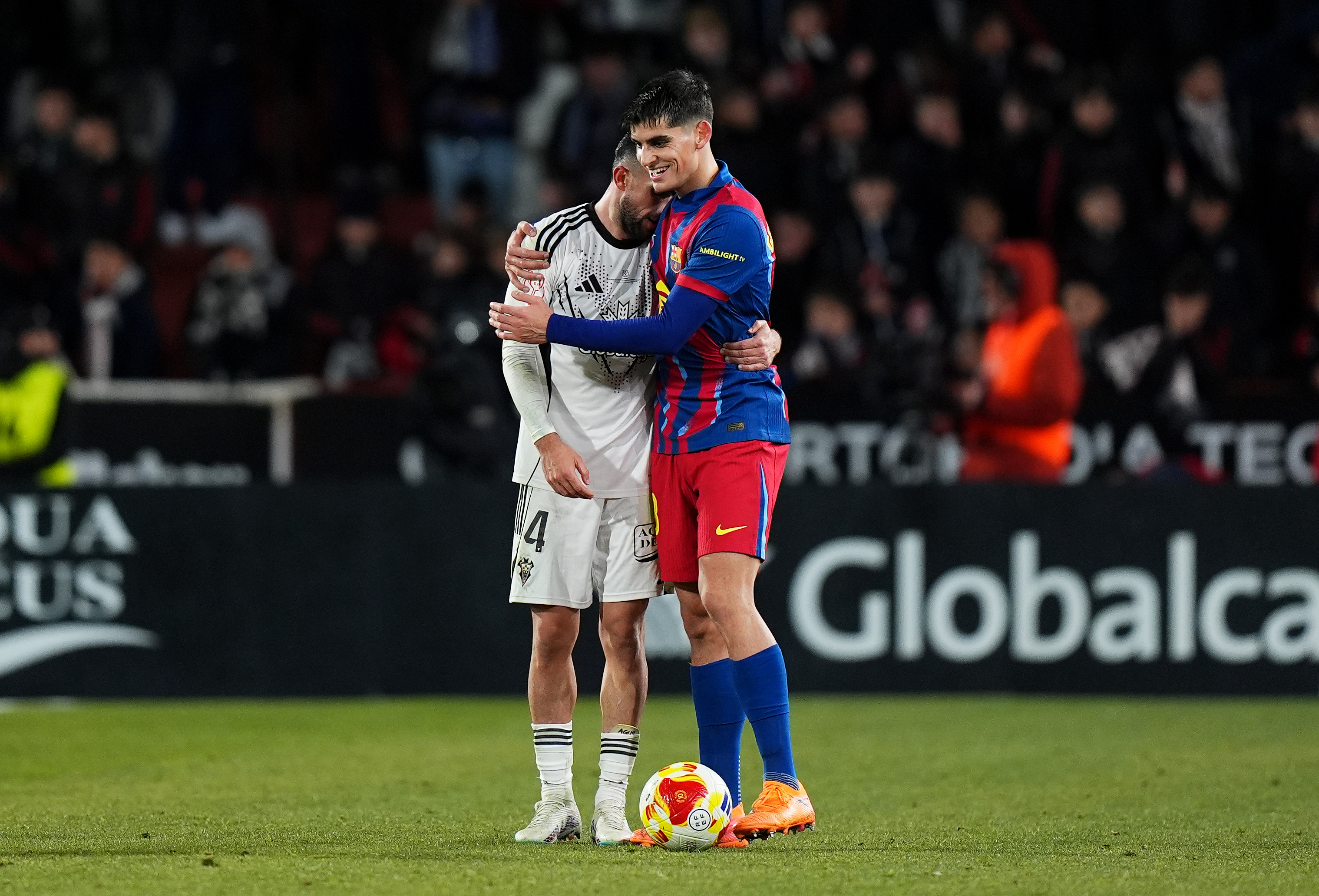 ALBACETE, SPAIN - FEBRUARY 03: Agustin Medina of Albacete Balompie embraces with Gerard Martin of FC Barcelona following the Copa Del Rey Quarter Final match between Albacete Balompie and FC Barcelona at Estadio Carlos Belmonte on February 03, 2026 in Albacete, Spain. (Photo by Angel Martinez/Getty Images)