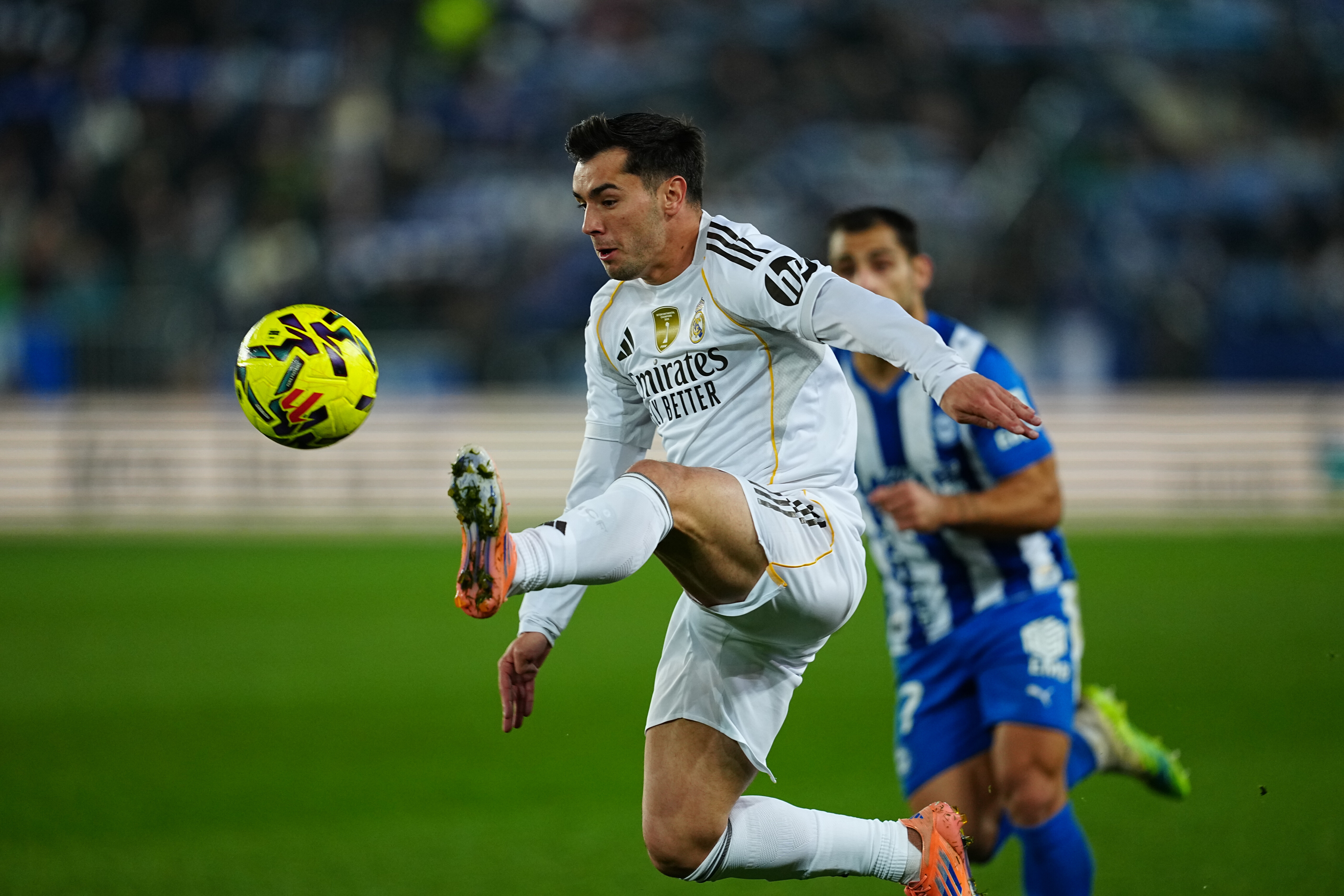 Real Madrid's Brahim Diaz challenges for the ball during the Spanish La Liga soccer match between Alaves and Real Madrid in Vitoria-Gasteiz, Spain, Sunday, Dec. 14, 2025. (AP Photo/Miguel Oses)