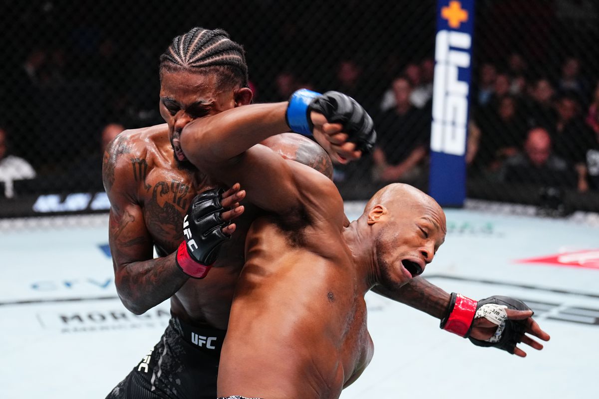 Michael Page landing a strike in the Octagon