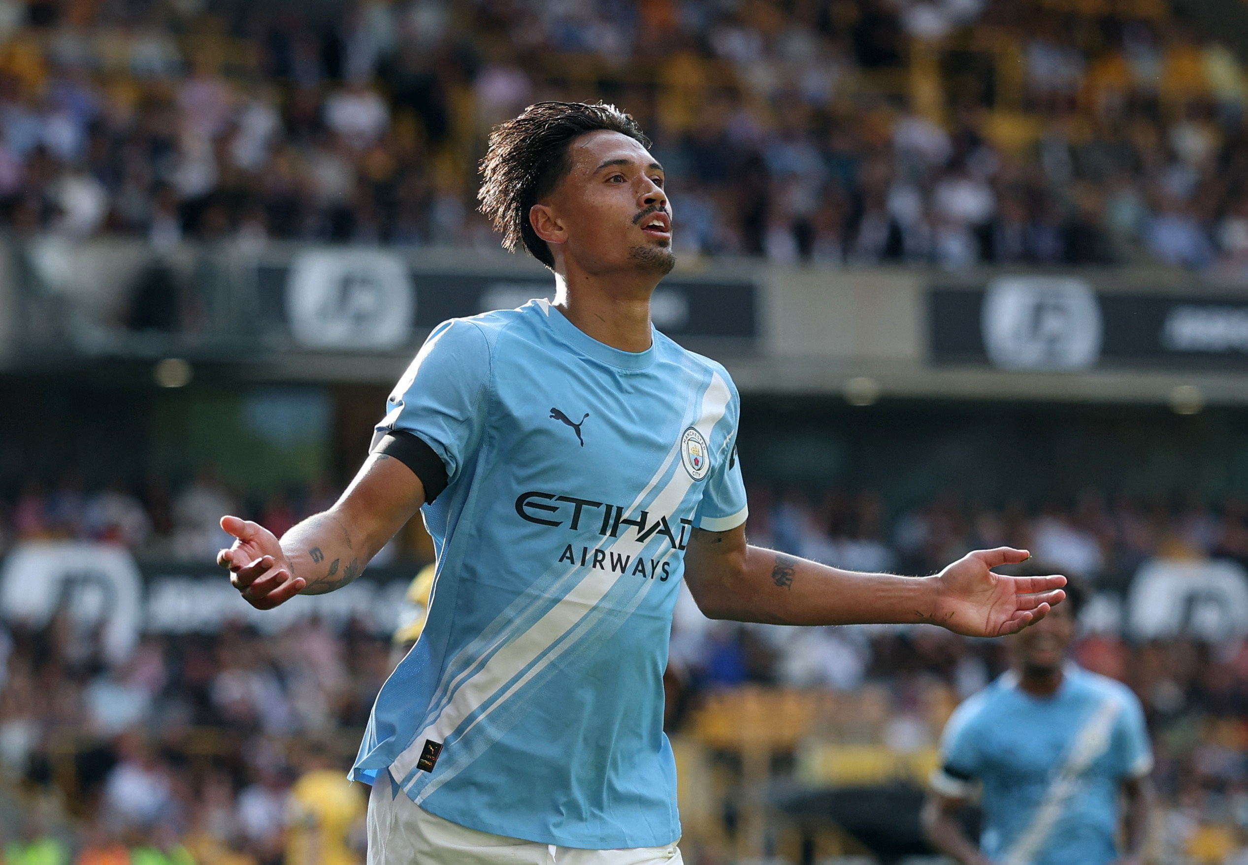 Soccer Football - Premier League - Wolverhampton Wanderers v Manchester City - Molineux Stadium, Wolverhampton, Britain - August 16, 2025 Manchester City's Tijjani Reijnders celebrates scoring their second goal Action Images via Reuters/Paul Childs EDITORIAL USE ONLY. NO USE WITH UNAUTHORIZED AUDIO, VIDEO, DATA, FIXTURE LISTS, CLUB/LEAGUE LOGOS OR 'LIVE' SERVICES. ONLINE IN-MATCH USE LIMITED TO 120 IMAGES, NO VIDEO EMULATION. NO USE IN BETTING, GAMES OR SINGLE CLUB/LEAGUE/PLAYER PUBLICATIONS. PLEASE CONTACT YOUR ACCOUNT REPRESENTATIVE FOR FURTHER DETAILS..