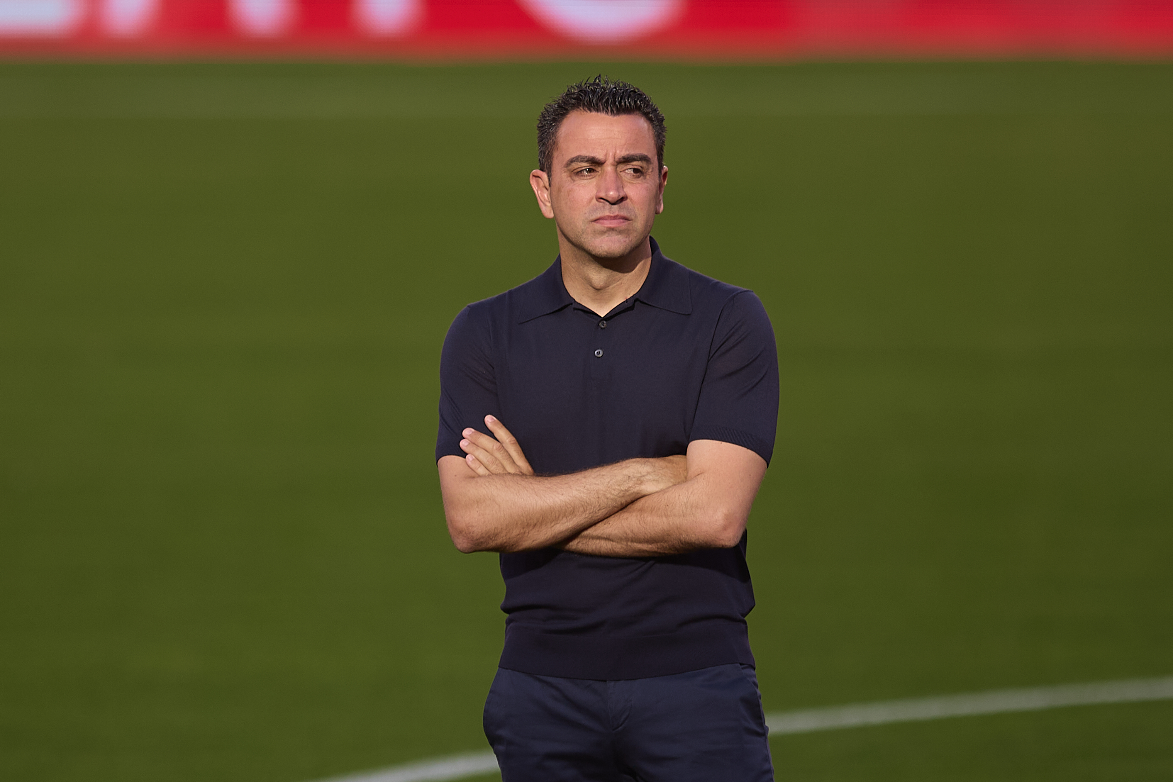 SEVILLE, SPAIN - MAY 26: Xavi, Head Coach of FC Barcelona, looks on before the LaLiga EA Sports match between Sevilla FC and FC Barcelona at Estadio Ramon Sanchez Pizjuan on May 26, 2024 in Seville, Spain. (Photo by Fran Santiago/Getty Images)