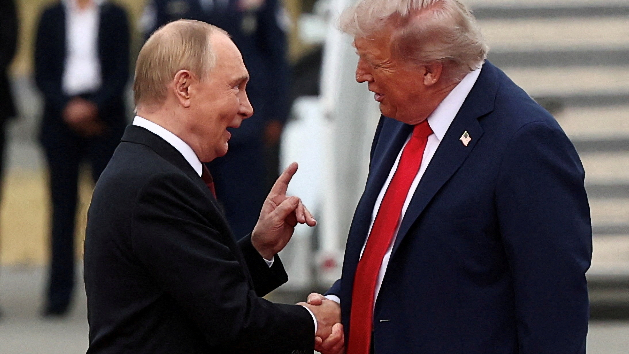 FILE PHOTO: U.S. President Donald Trump shakes hand with Russian President Vladimir Putin, as they meet to negotiate for an end to the war in Ukraine, at Joint Base Elmendorf-Richardson in Anchorage, Alaska, U.S., August 15, 2025. REUTERS/Kevin Lamarque/File Photo