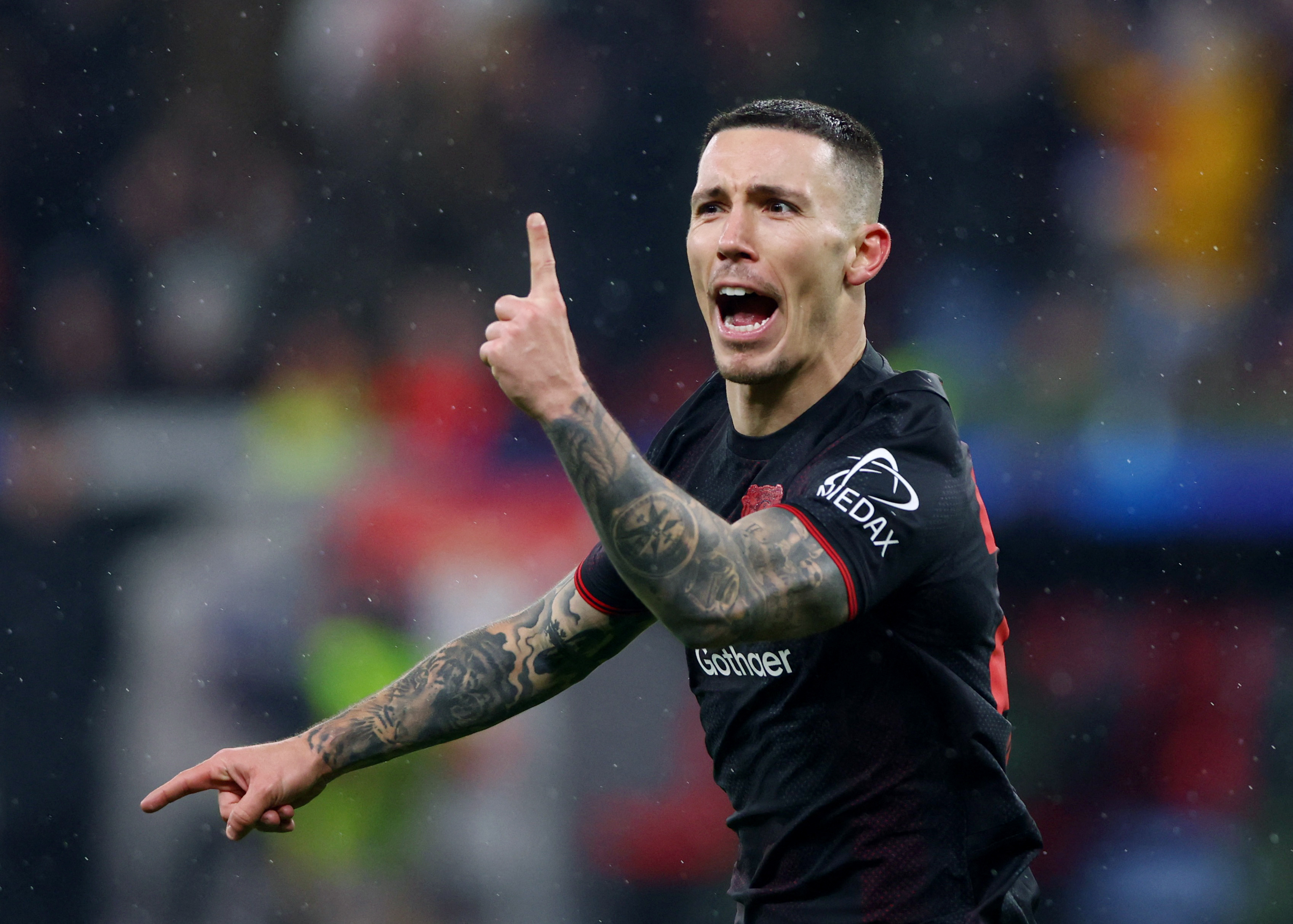 Soccer Football - UEFA Champions League - Bayer Leverkusen v Villarreal - BayArena, Leverkusen, Germany - January 28, 2026 Bayer Leverkusen's Alex Grimaldo celebrates scoring their third goal REUTERS/Thilo Schmuelgen