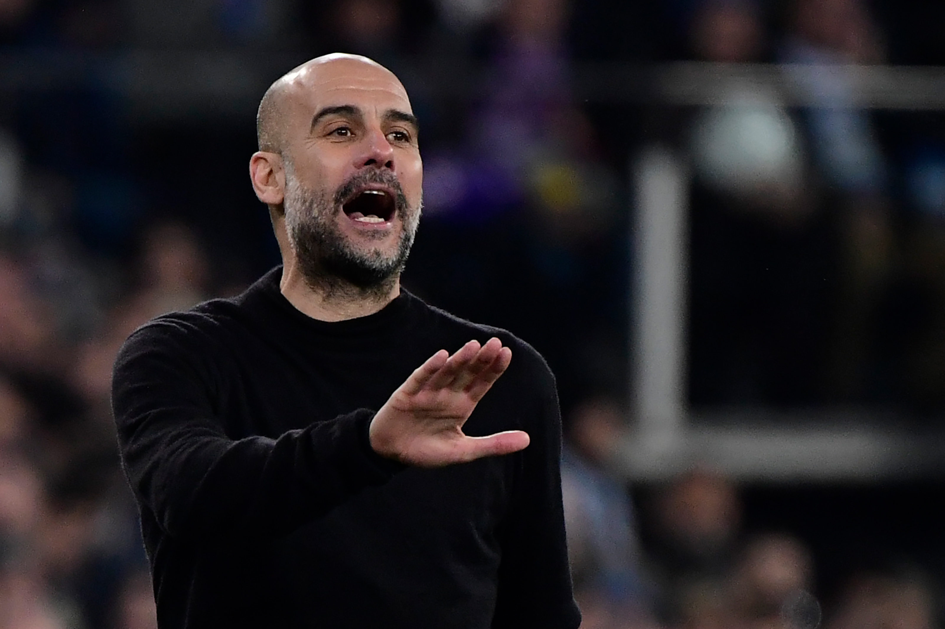 Manchester City's Spanish manager Pep Guardiola gestures during the UEFA Champions League round of 16 first-leg football match between Real Madrid CF and Manchester City at the Santiago Bernabeu stadium in Madrid on February 26, 2020. (Photo by JAVIER SORIANO / AFP)