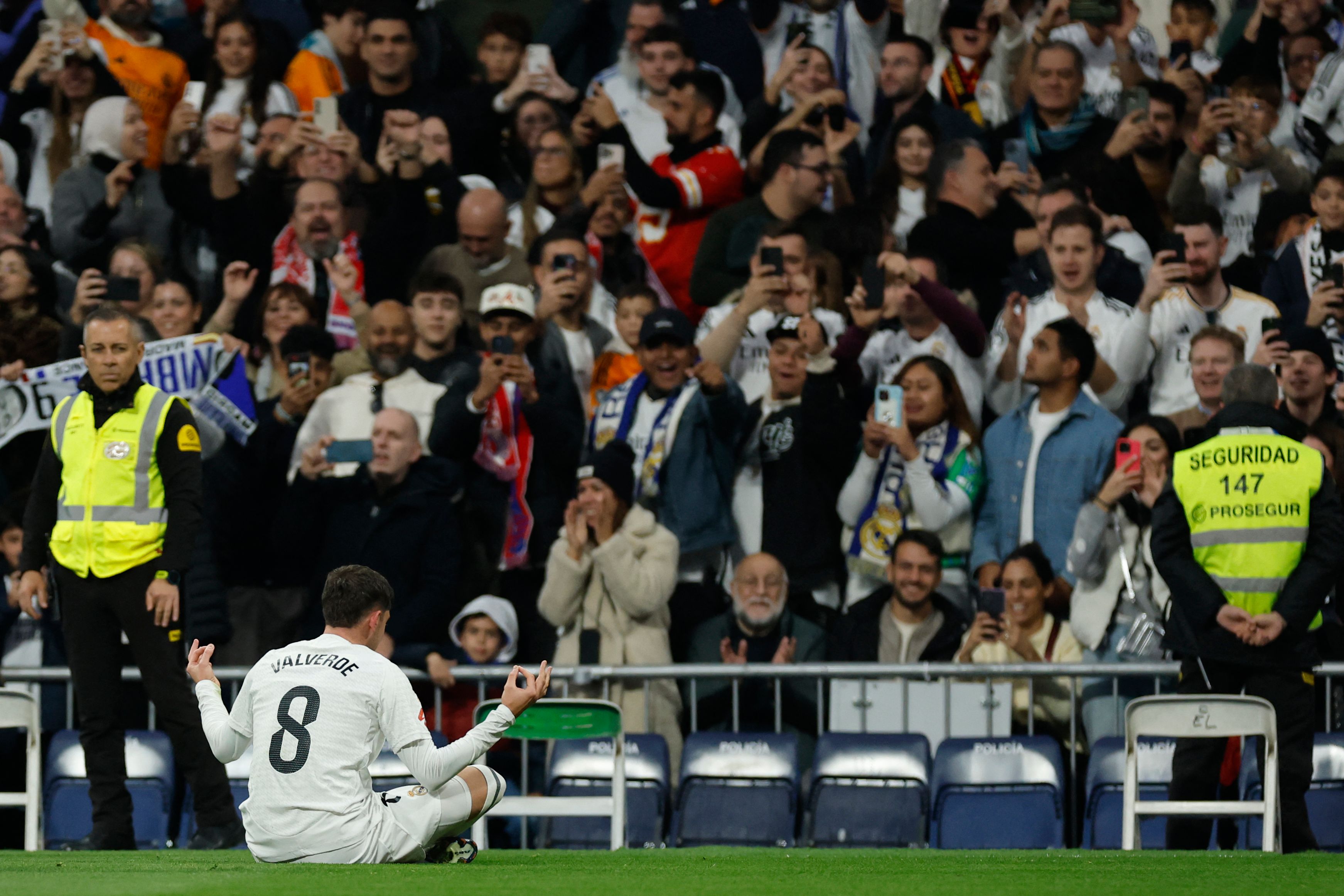 Real Madrid's Uruguayan midfielder #08 Federico Valverde celebrates scoring his team's second goal during the Spanish league football match between Real Madrid CF and Sevilla FC at the Santiago Bernabeu stadium in Madrid on December 22, 2024. (Photo by OSCAR DEL POZO / AFP)