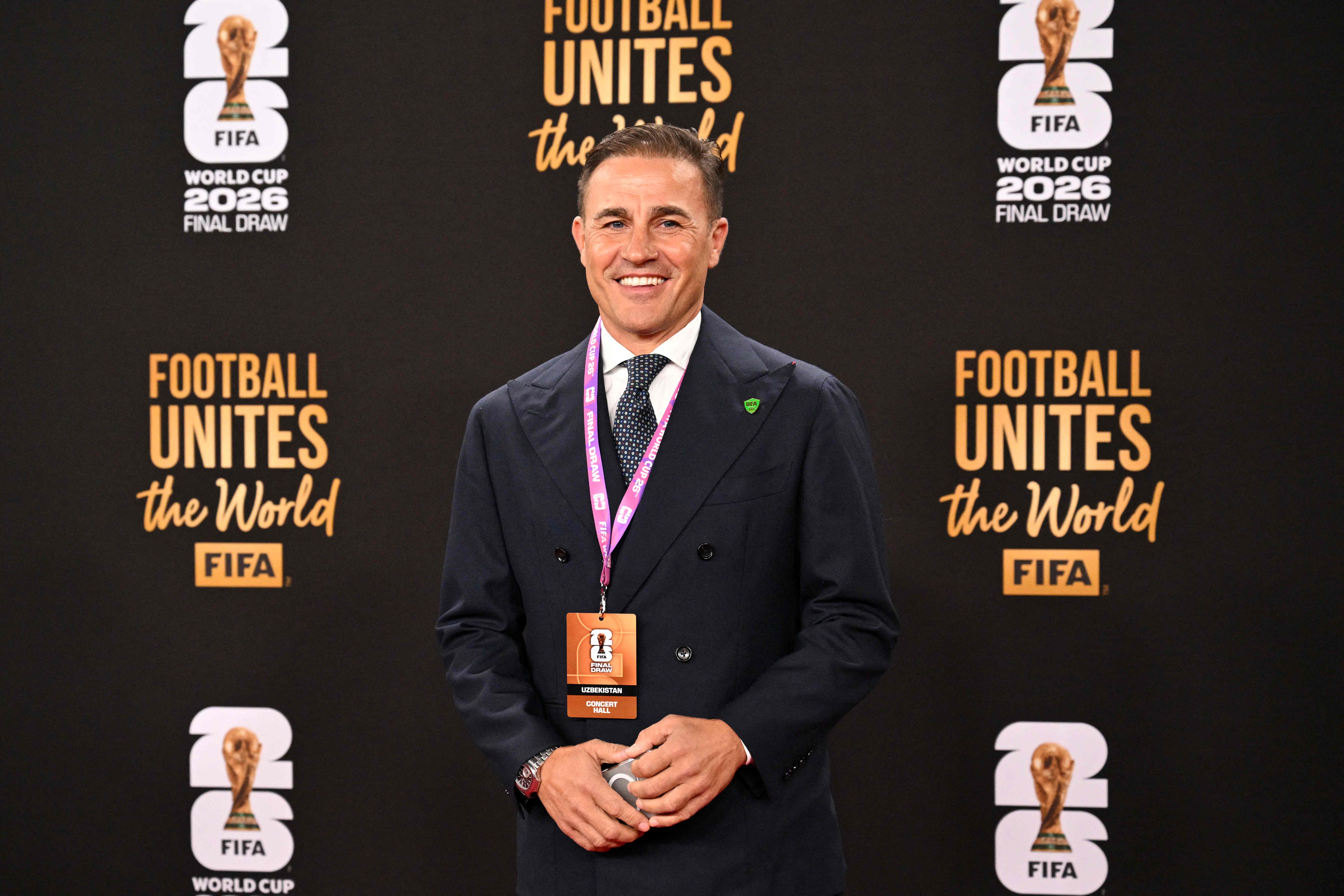 Uzbekistan's Italian head coach Fabio Cannavaro poses on the red carpet upon arrival to attend the draw for the 2026 FIFA Football World Cup taking place in the US, Canada and Mexico, at the Kennedy Center, in Washington, DC, on December 5, 2025. (Photo by Roberto SCHMIDT / AFP)