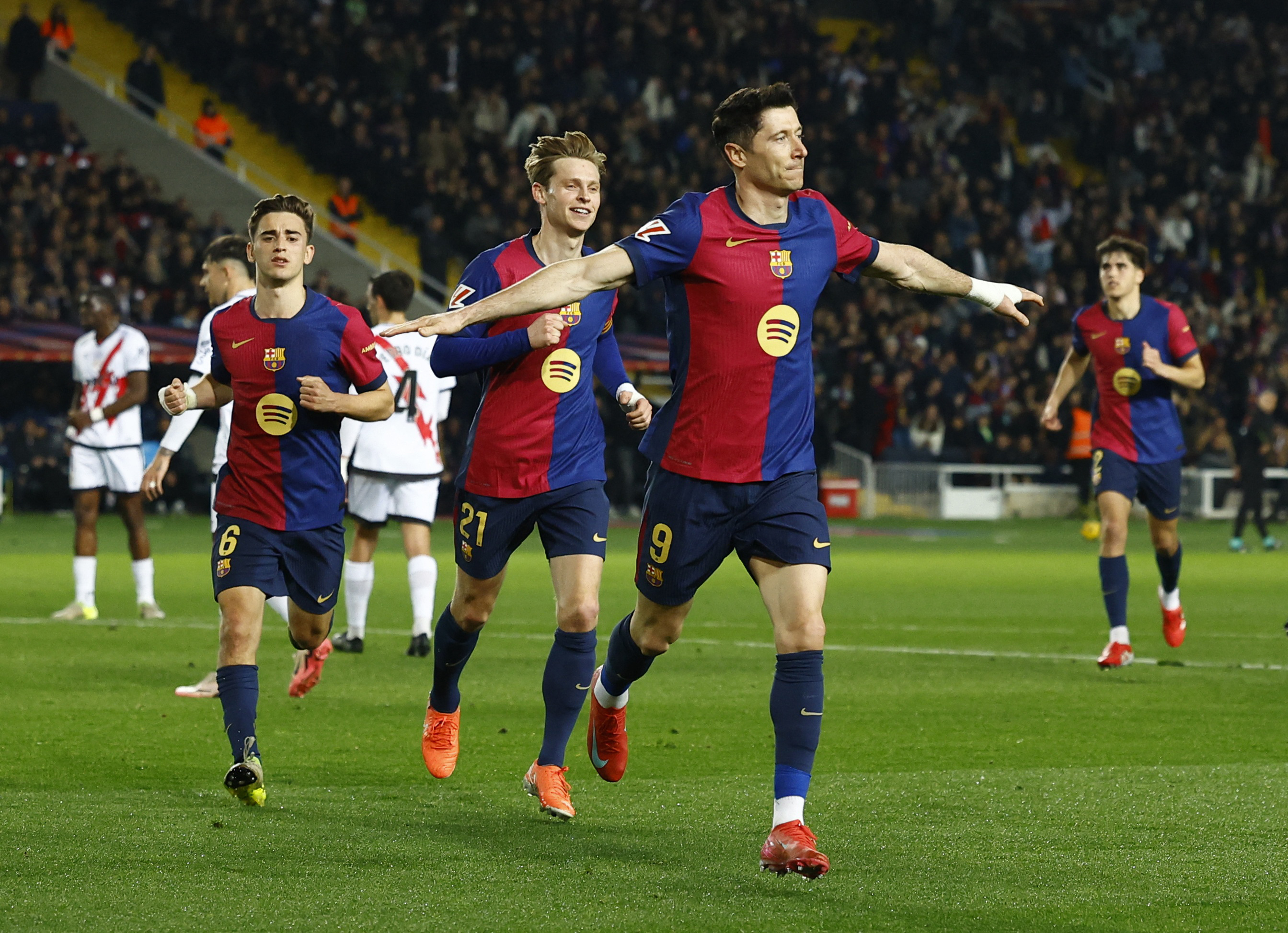 Soccer Football - LaLiga - FC Barcelona v Rayo Vallecano - Estadi Olimpic Lluis Companys, Barcelona, Spain - February 17, 2025 FC Barcelona's Robert Lewandowski celebrates scoring their first goal with teammates REUTERS/Albert Gea