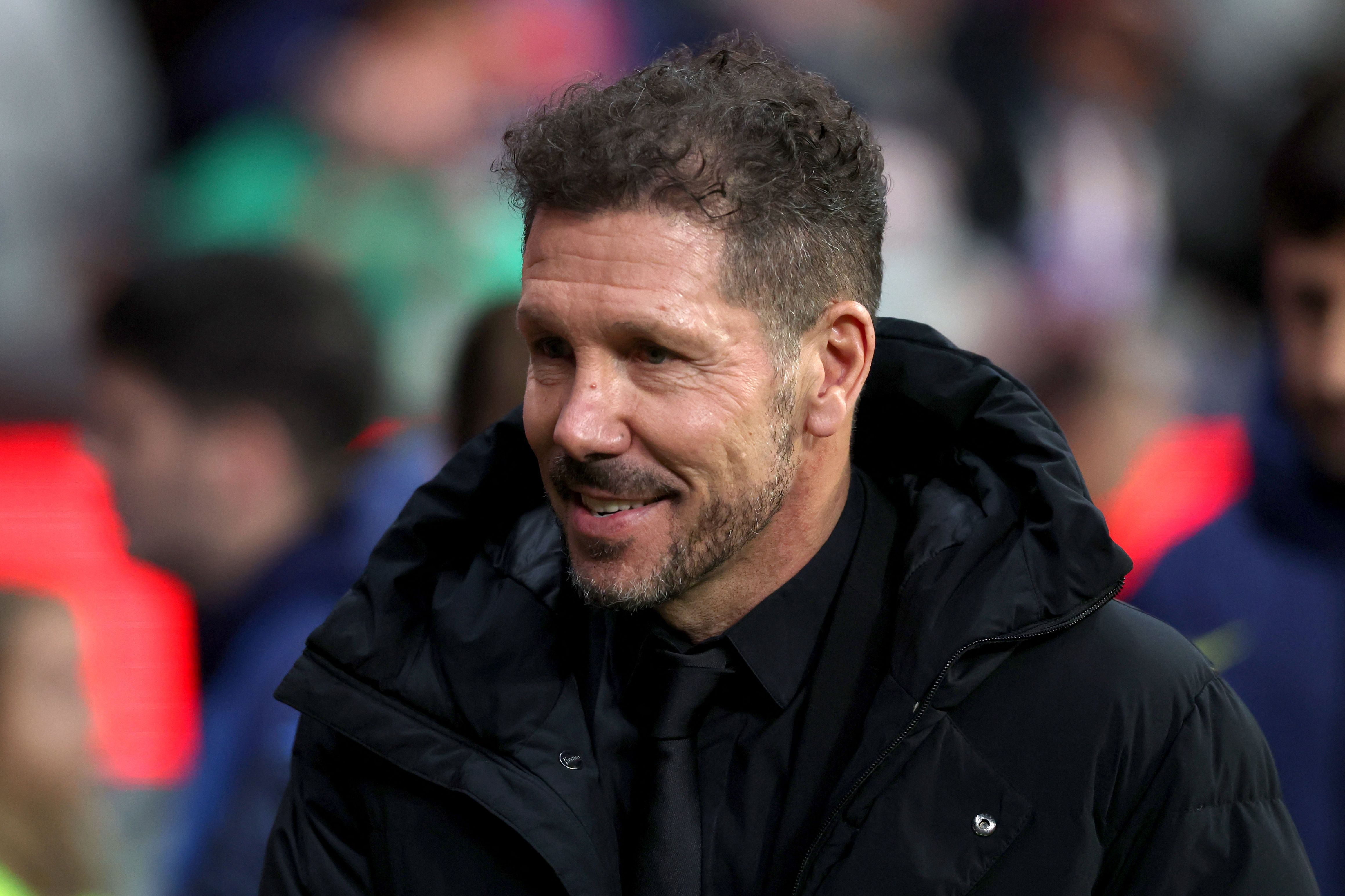 Atletico Madrid's Argentine coach Diego Simeone smiles during the Spanish Copa del Rey (King's Cup) semi final first leg football match between Club Atletico de Madrid and FC Barcelona at Metropolitano Stadium in Madrid on February 12, 2026. (Photo by Pierre-Philippe MARCOU / AFP)