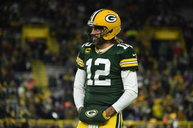 October 24, 2021: Green Bay Packers quarterback Aaron Rodgers #12 warms up  before the NFL football game between the Washington Football Team and the  Green Bay Packers at Lambeau Field in Green