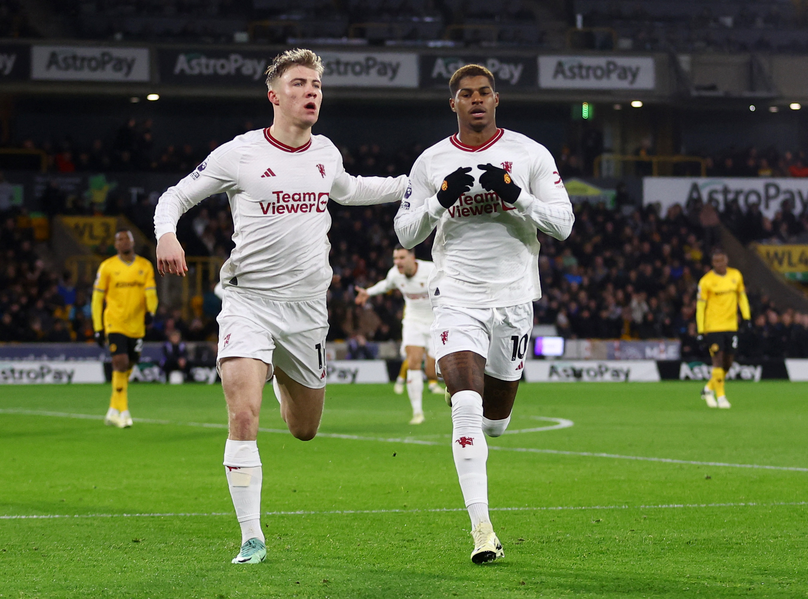 Soccer Football - Premier League - Wolverhampton Wanderers v Manchester United - Molineux Stadium, Wolverhampton, Britain - February 1, 2024 Manchester United's Marcus Rashford celebrates scoring their first goal with Rasmus Hojlund REUTERS/Carl Recine NO USE WITH UNAUTHORIZED AUDIO, VIDEO, DATA, FIXTURE LISTS, CLUB/LEAGUE LOGOS OR 'LIVE' SERVICES. ONLINE IN-MATCH USE LIMITED TO 45 IMAGES, NO VIDEO EMULATION. NO USE IN BETTING, GAMES OR SINGLE CLUB/LEAGUE/PLAYER PUBLICATIONS.