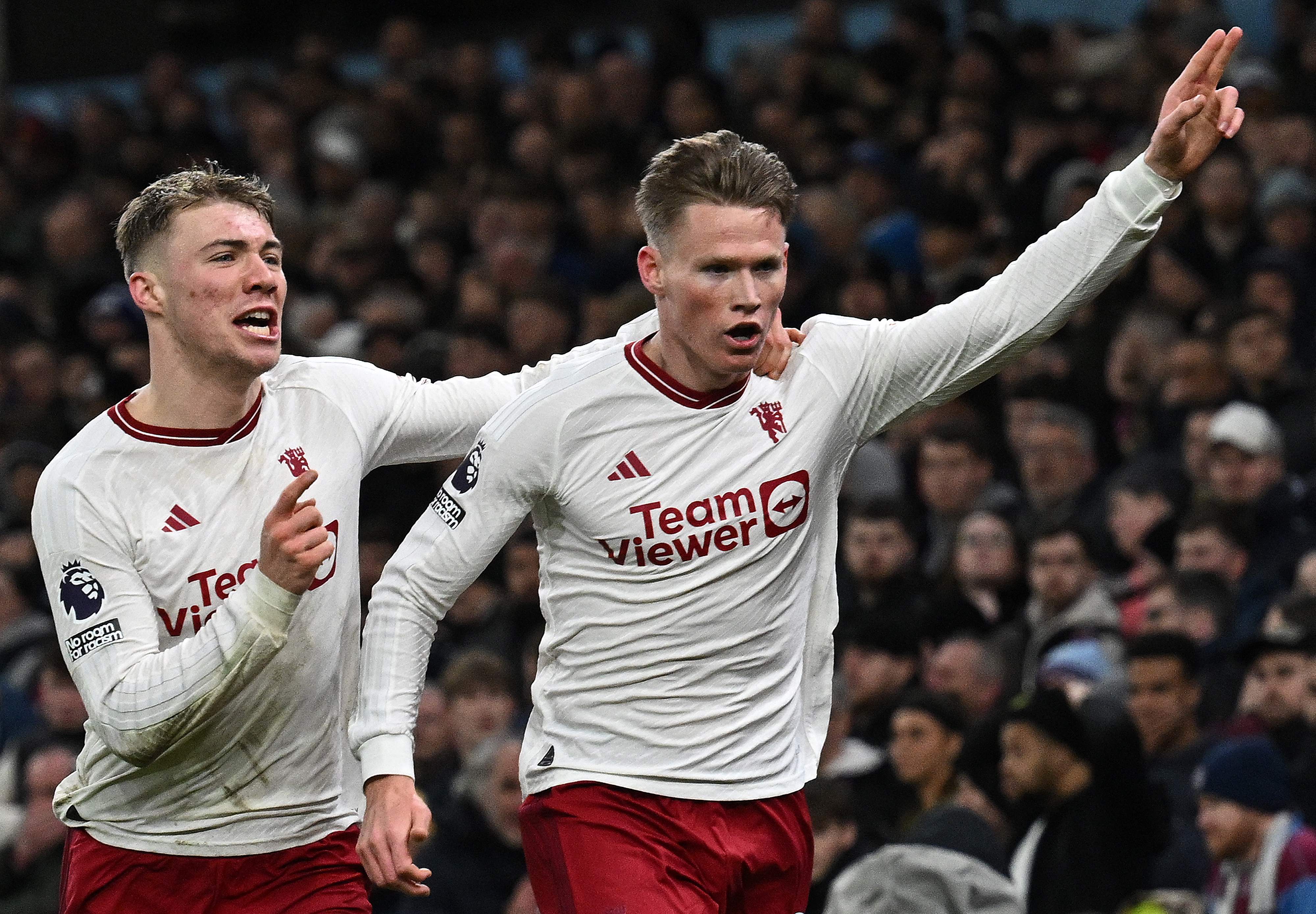 Manchester United's Scottish midfielder #39 Scott McTominay celebrates scoring the team's second goal with Manchester United's Danish striker #11 Rasmus Hojlund during the English Premier League football match between Aston Villa and Manchester United at Villa Park in Birmingham, central England on February 11, 2024. (Photo by Paul ELLIS / AFP) / RESTRICTED TO EDITORIAL USE. No use with unauthorized audio, video, data, fixture lists, club/league logos or 'live' services. Online in-match use limited to 120 images. An additional 40 images may be used in extra time. No video emulation. Social media in-match use limited to 120 images. An additional 40 images may be used in extra time. No use in betting publications, games or single club/league/player publications. / 