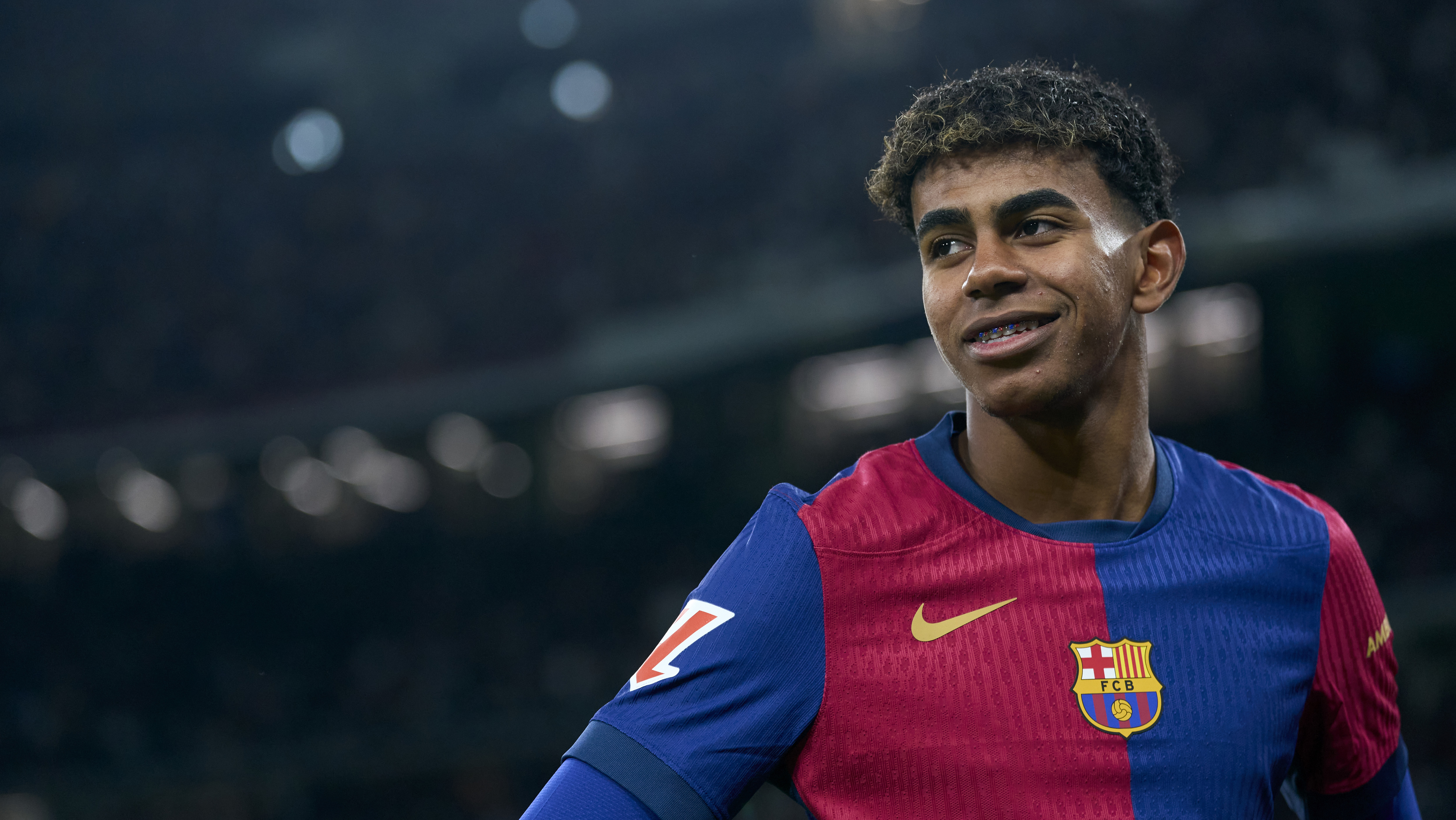 MADRID, SPAIN - OCTOBER 26: Lamine Yamal of FC Barcelona looks on prior to the LaLiga EA Sports match between Real Madrid CF and FC Barcelona at Estadio Santiago Bernabeu on October 26, 2024 in Madrid, Spain. (Photo by Mateo Villalba/Getty Images)