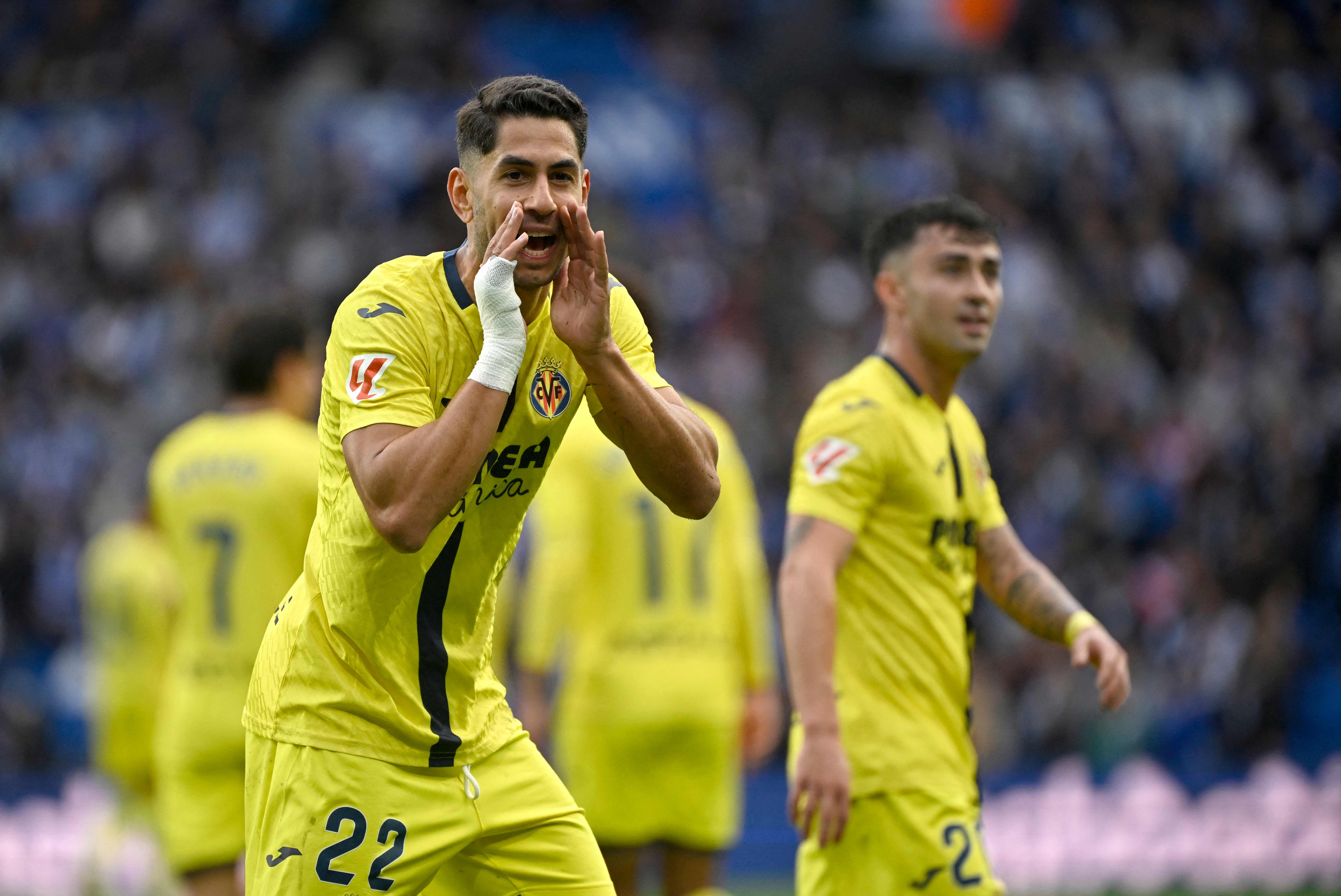 Villarreal's Spanish forward #22 Ayoze Perez Gutierrez celebrates scoring his team's first goal during the Spanish league football match between Real Sociedad and Villarreal CF at Anoeta Stadium in San Sebastian on November 30, 2025.