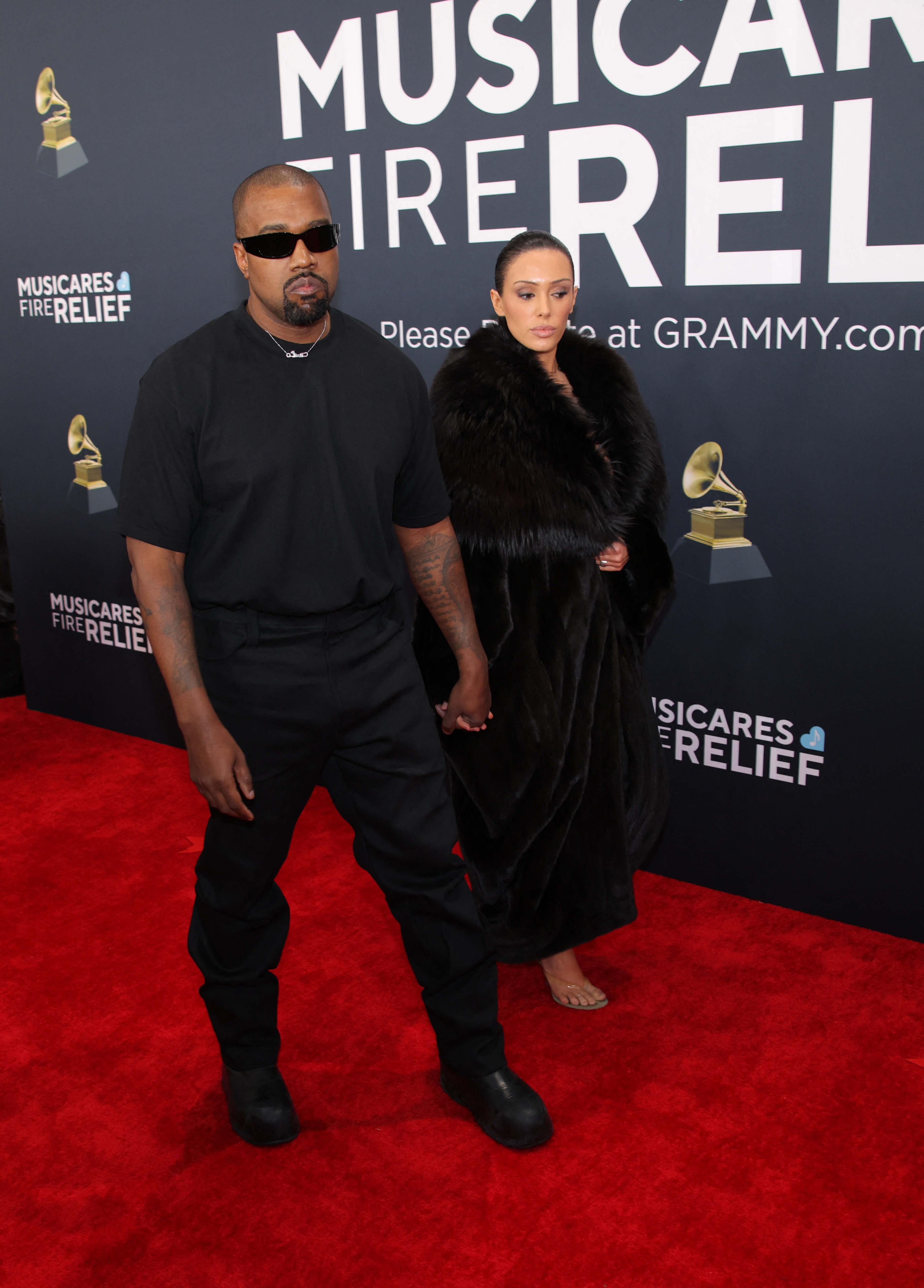 Police escort as Kanye West's wife Bianca Censori shocks in nude outfit at  2025 Grammys - AS USA