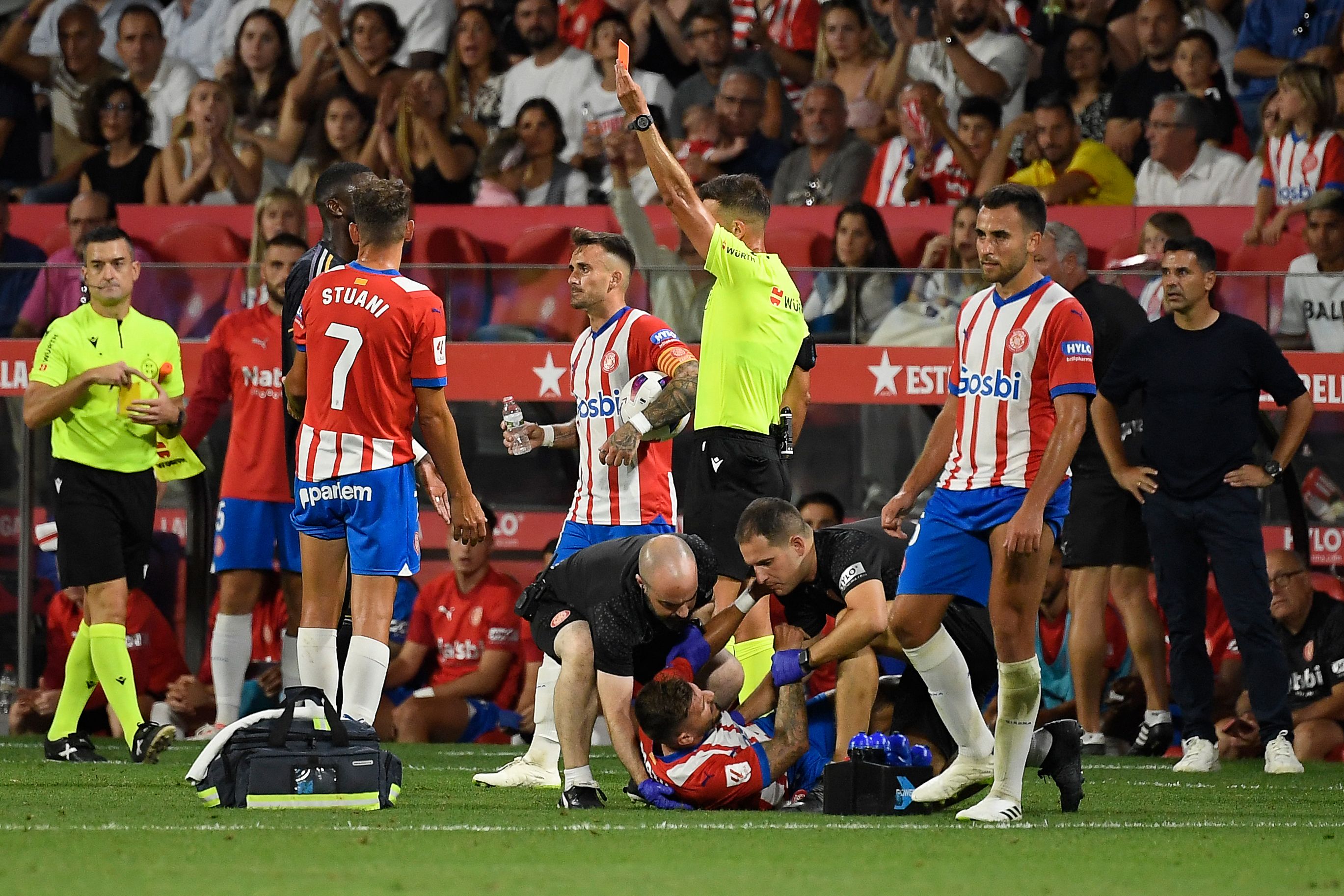 Girona's Spanish forward Portu receives medical attention during the Spanish Liga football match between Girona FC and Real Madrid CF at the Montilivi stadium in Girona on September 30, 2023. (Photo by Josep LAGO / AFP)