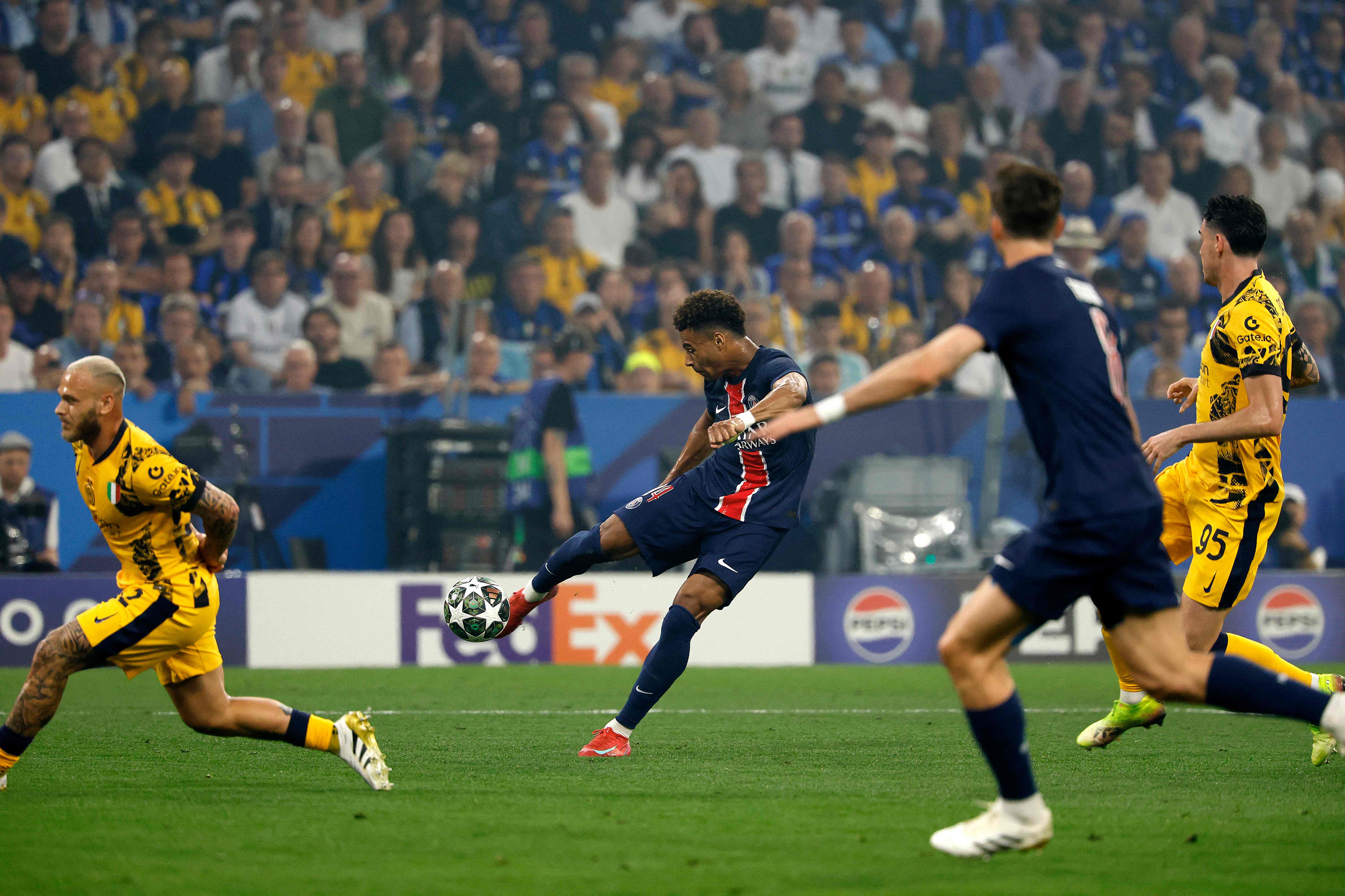 Paris Saint-Germain's French midfielder #14 Desire Doue (C) scores his team's second goal during the UEFA Champions League final football match between Paris Saint-Germain (PSG) and Inter Milan in Munich, southern Germany, on May 31, 2025. (Photo by Odd ANDERSEN / AFP)