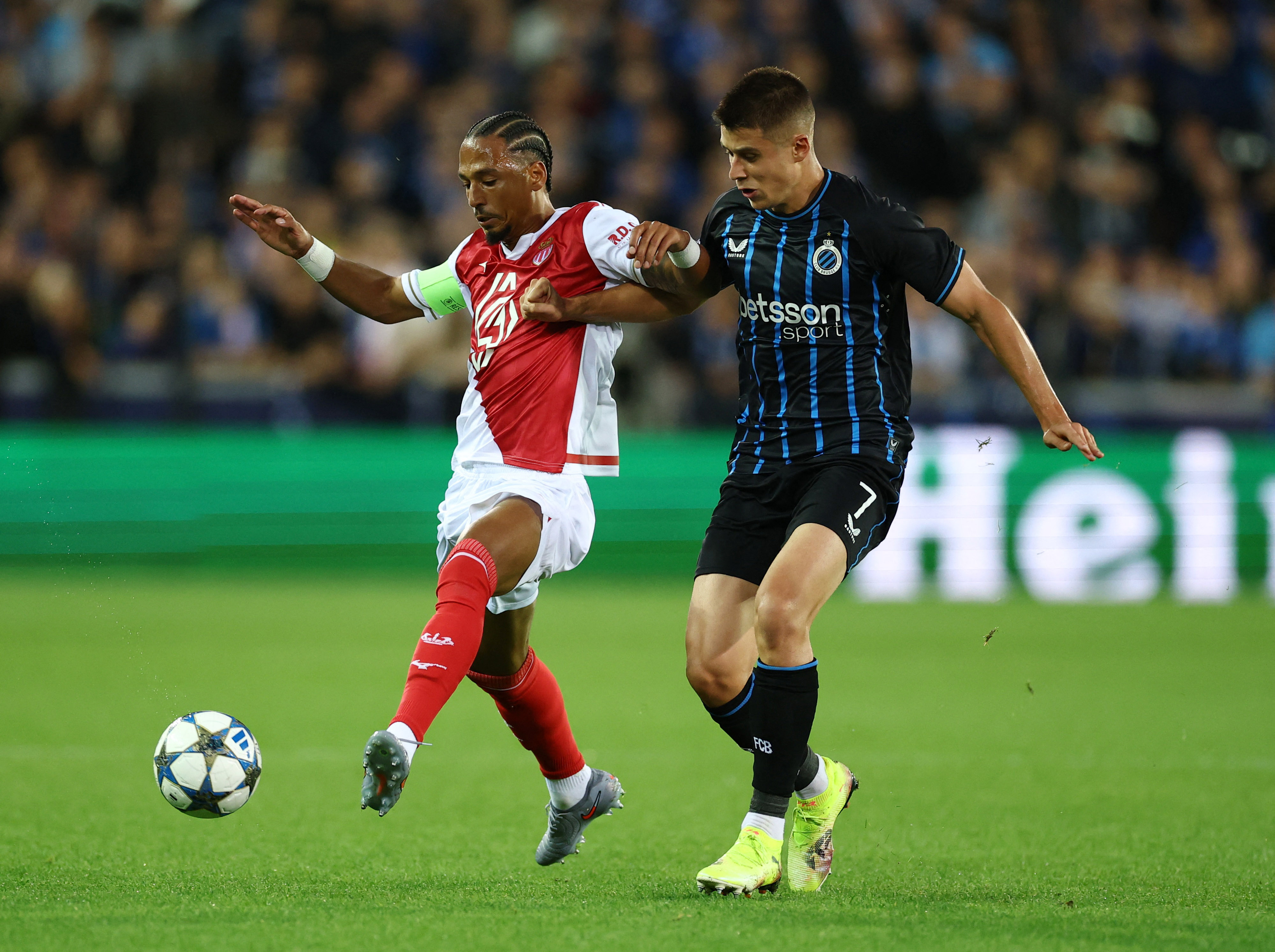 Soccer Football - UEFA Champions League - Club Brugge v AS Monaco - Jan Breydel Stadium, Bruges, Belgium - September 18, 2025 AS Monaco's Thilo Kehrer in action with Club Brugge's Nicolo Tresoldi REUTERS/Yves Herman