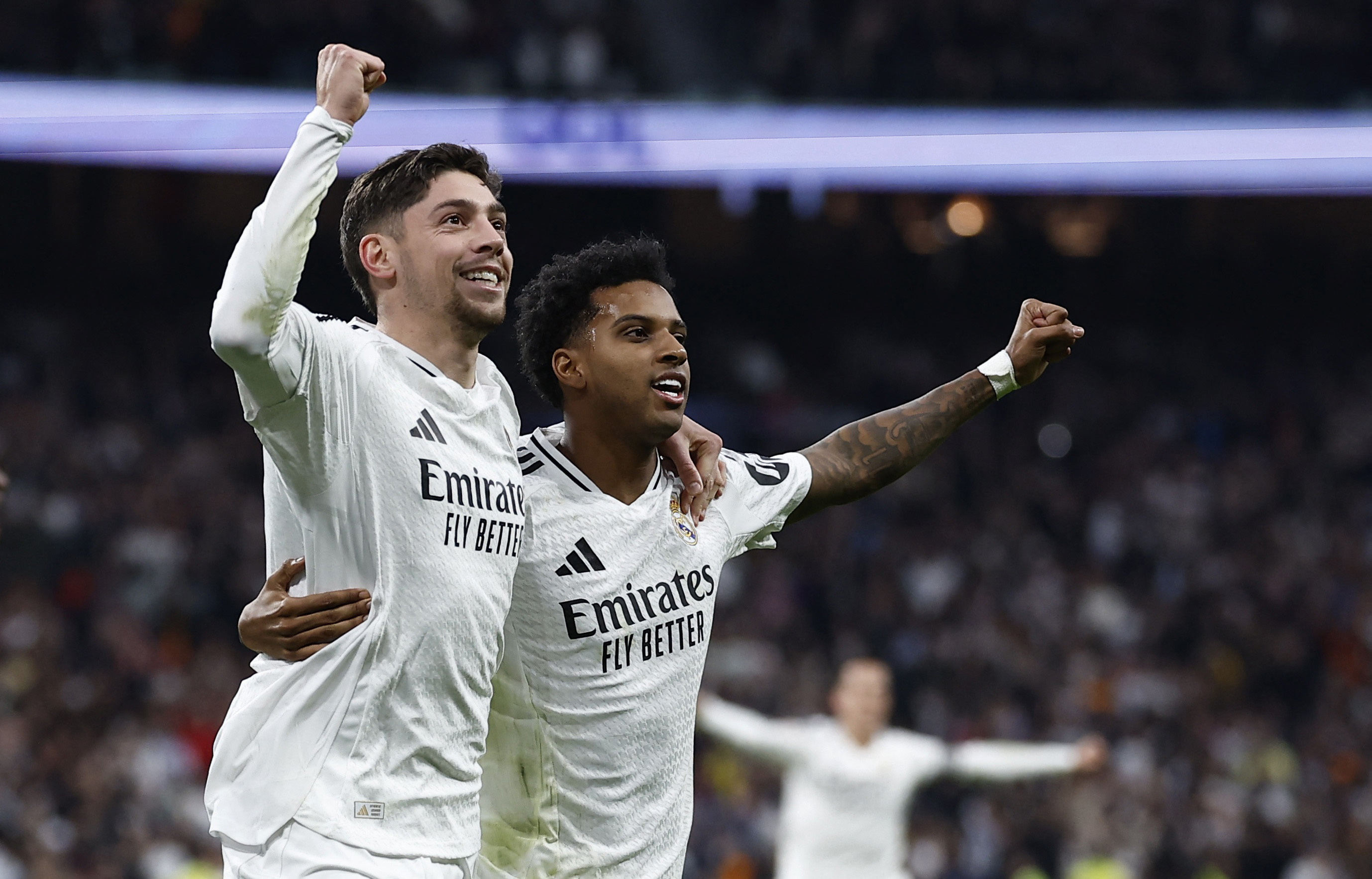 Soccer Football - LaLiga - Real Madrid v Sevilla - Santiago Bernabeu, Madrid, Spain - December 22, 2024 Real Madrid's Federico Valverde celebrates scoring their second goal with Rodrygo REUTERS/Juan Medina