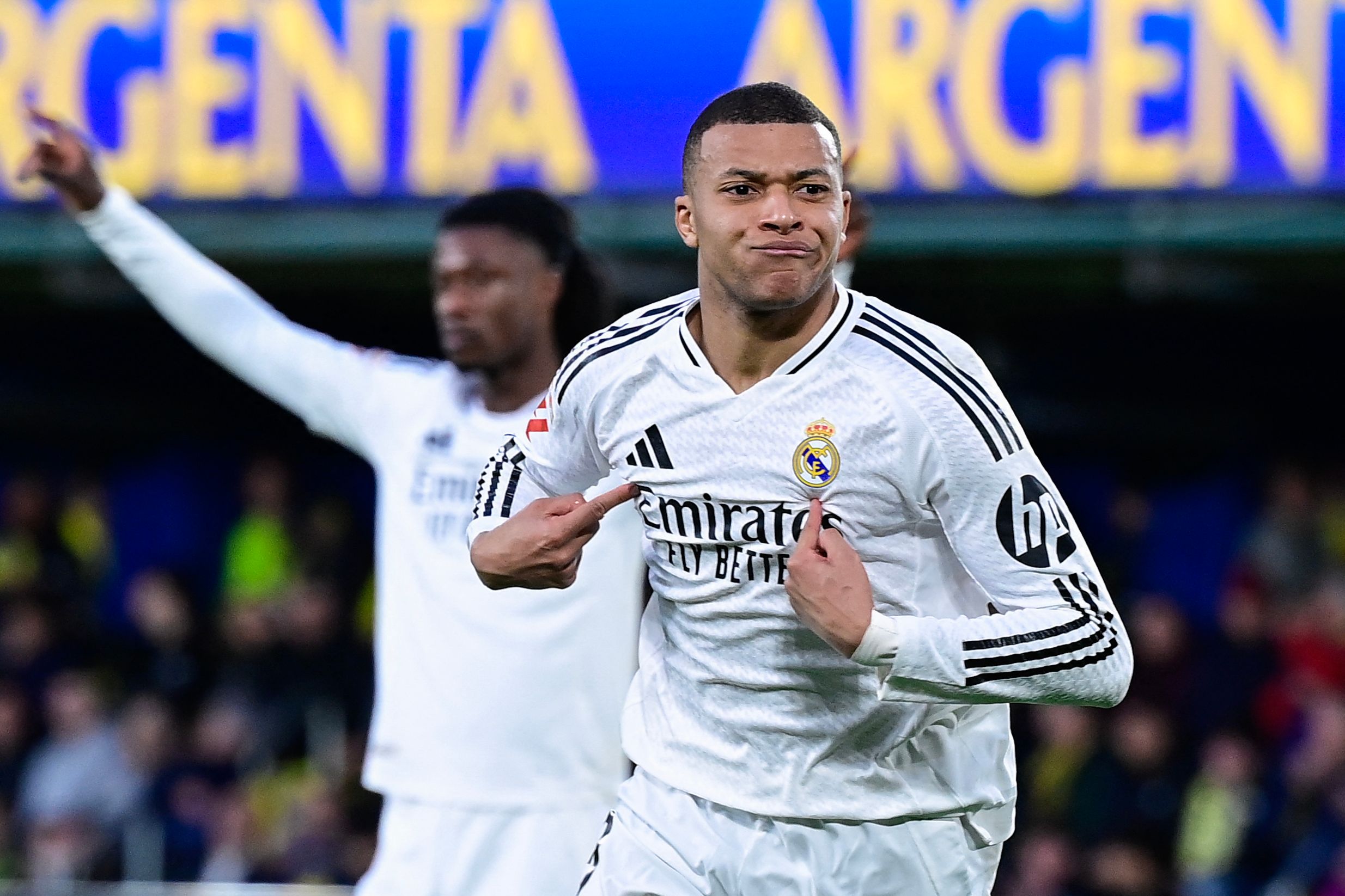 Real Madrid's French forward #09 Kylian Mbappe celebrates after scoring their second goal during the Spanish League football match between Villarreal CF and Real Madrid CF at La Ceramica Stadium in Vila-real on March 15, 2025. (Photo by JOSE JORDAN / AFP)