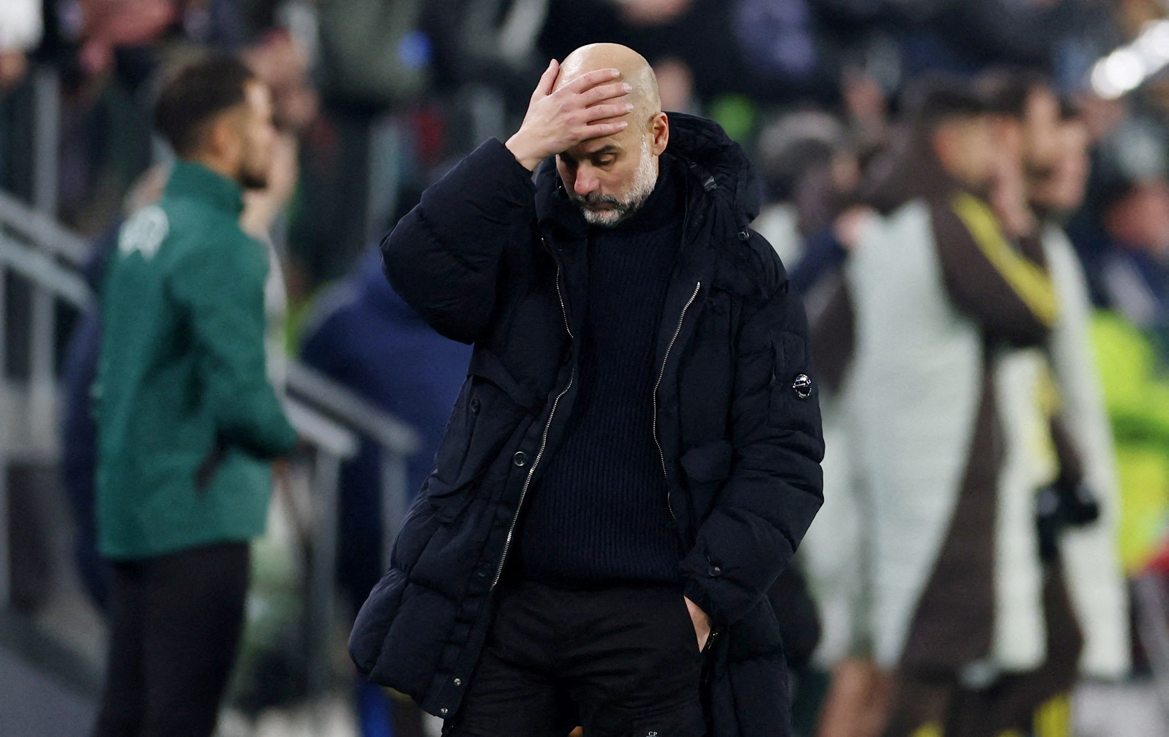 FILE PHOTO: Soccer Football - Champions League - Juventus v Manchester City - Allianz Stadium, Turin, Italy - December 11, 2024 Manchester City manager Pep Guardiola reacts at the end of the match REUTERS/Claudia Greco/File Photo