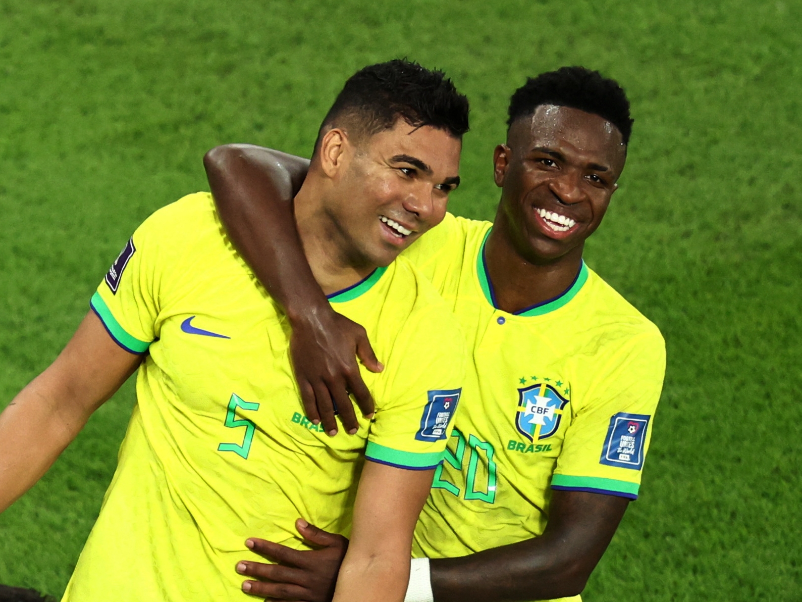 Soccer Football - FIFA World Cup Qatar 2022 - Group G - Brazil v Switzerland - Stadium 974, Doha, Qatar - November 28, 2022 Brazil's Casemiro celebrates scoring their first goal with Vinicius Junior REUTERS/Marko Djurica