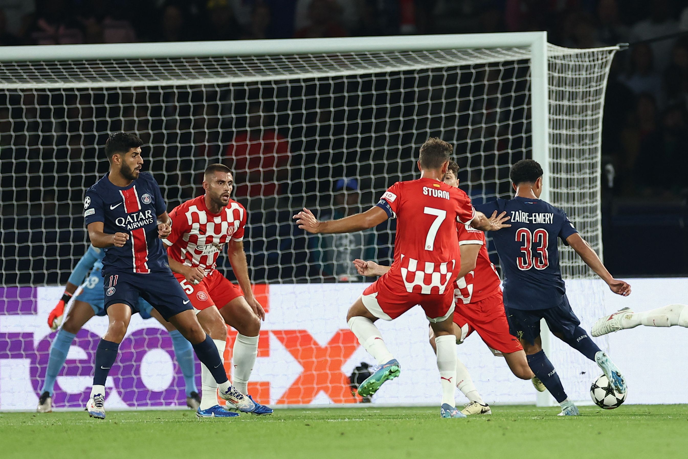 Paris Saint-Germain's French midfielder #33 Warren Zaire-Emery (R) shoots towards goal during the UEFA Champions League 1st round day 1 football match between Paris Saint-Germain (PSG) and Girona FC at the Parc des Princes Stadium, in Paris, on September 18, 2024. (Photo by FRANCK FIFE / AFP)